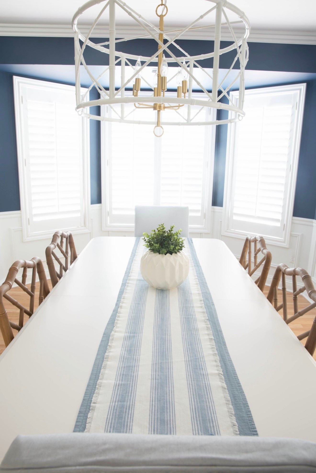 This navy blue coastal dining room with a white dining table, blue dining chairs, and a white bamboo chandelier is one of my favorite modern coastal spaces. I love how the deep blue walls paired with crisp white furniture and natural textures create a bright, layered, designer-inspired look. 

#LTKU #LTKSaleAlert #LTKHome