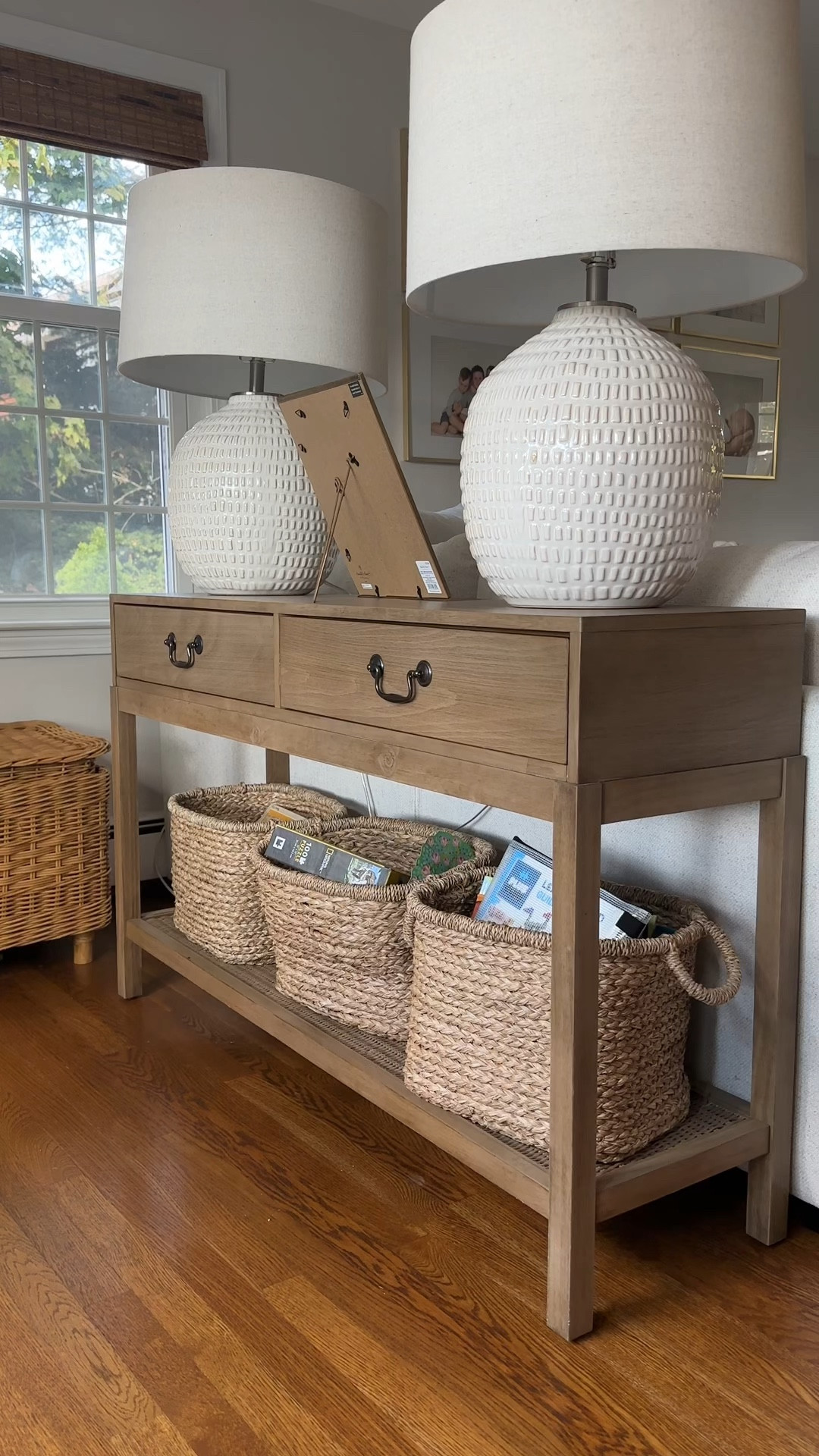 Living room console table decor! I used the lamps I already had and added in some new coffee table books, a decorative bowl and a pretty picture frame. The console table is the “Everett Foyer Console” from World Market and I can’t link it unfortunately. 

#LTKstyletip #LTKVideo #LTKhome
