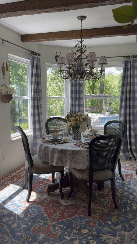 Breakfast nook ideas and decor, faux beams, crystal chandelier with pleated chandelier lampshades, colorful rug, large area rug, toile tablecloth, cottage style decor, French country table cloth, gingham curtains, buffalo check drapes panels

#LTKSeasonal #LTKVideo #LTKhome