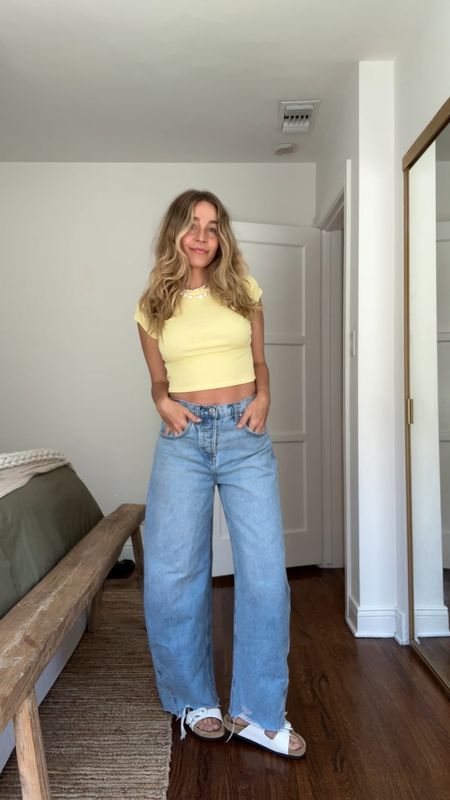 Yellow crop top with my favorite barrel jeans!! Wearing a 26 in the jeans, small in the top. Linked exact sandals and pearl choker necklace too! 

#LTKVideo #LTKFindsUnder50 #LTKShoeCrush
