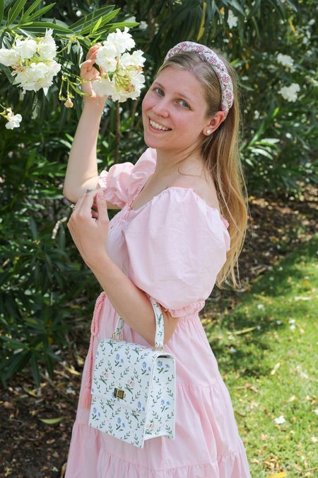Light pink tiered puff sleeve dress with floral headband and purse. Cottagecore spring/summer dress  

#LTKSeasonal