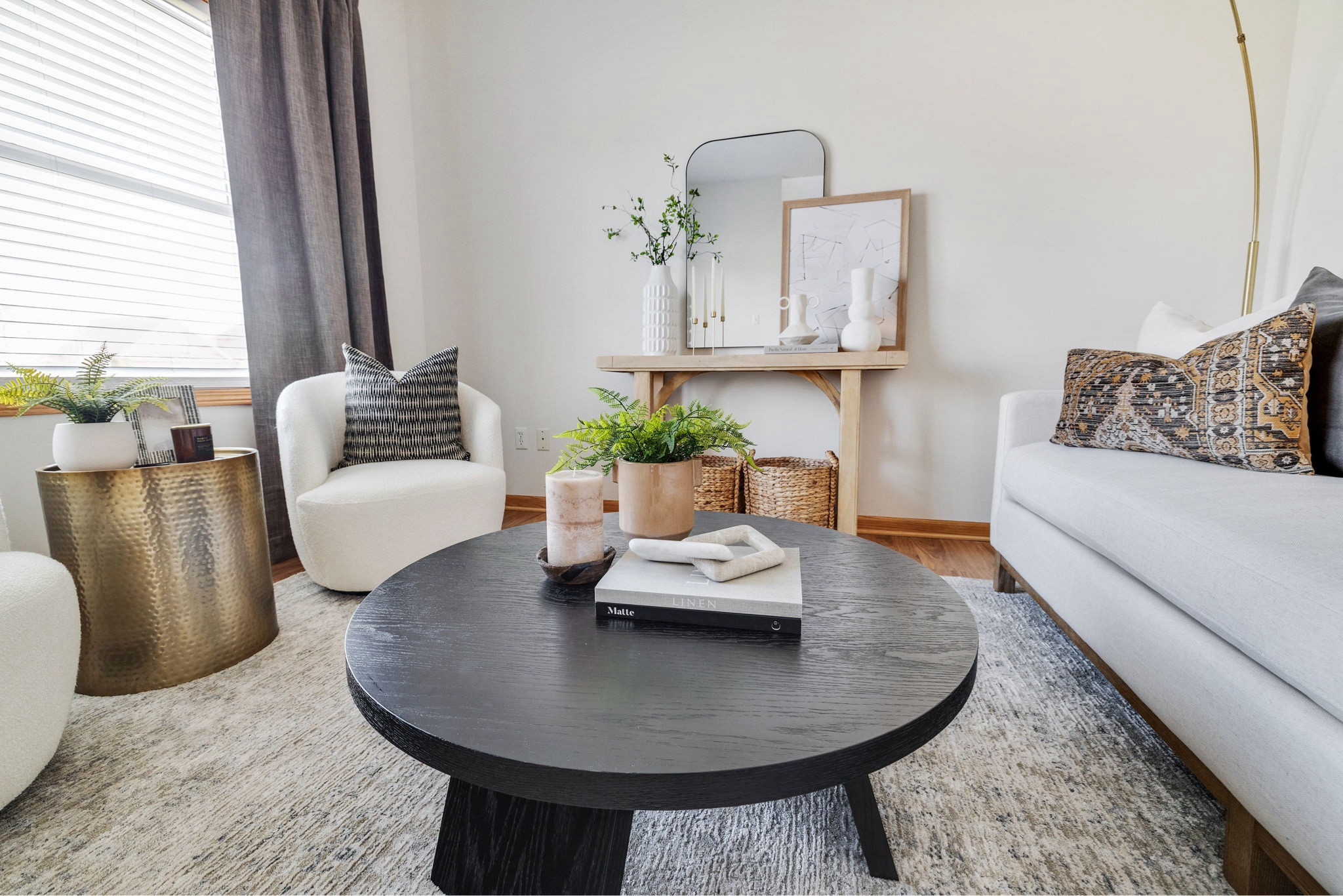 Front Room- Black coffee table, White arm chairs and Grey curtains 

#LTKHome