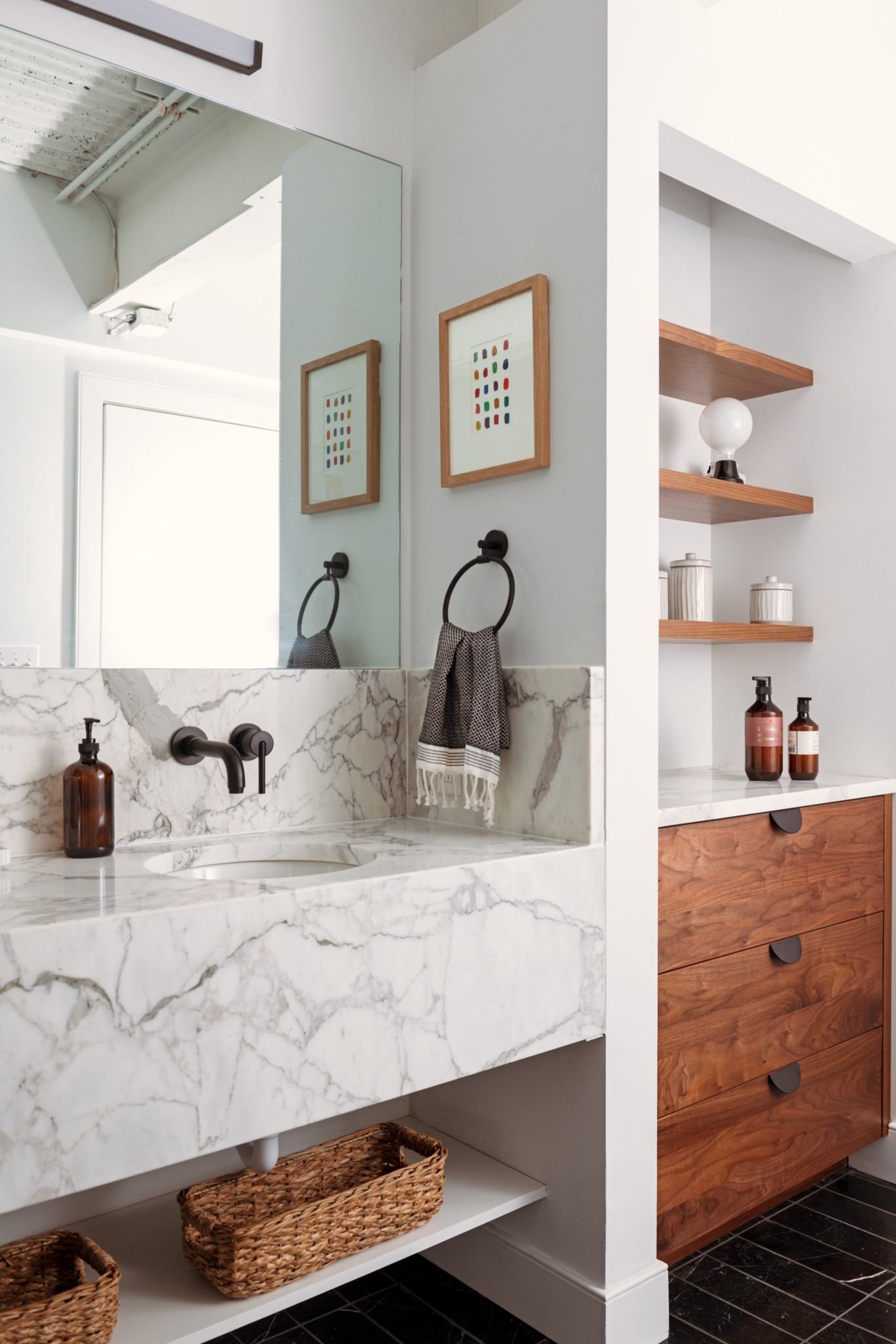 A modern industrial loft bathroom design with black hardware, marble counters and wall mounted faucets

#LTKhome #LTKFind