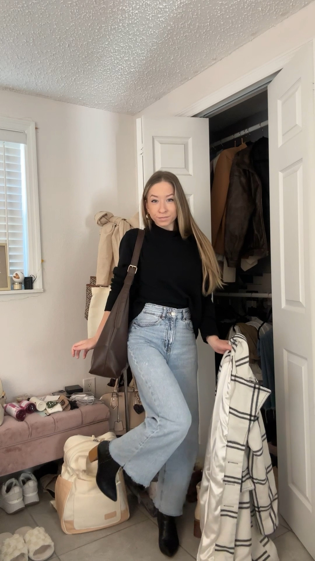 winter outfit idea wearing a black crewneck sweater and jeans with a striped coat! linked similar on amazon & wearing my favorite h&m jeans🫶🏻

#LTKSeasonal #LTKootd