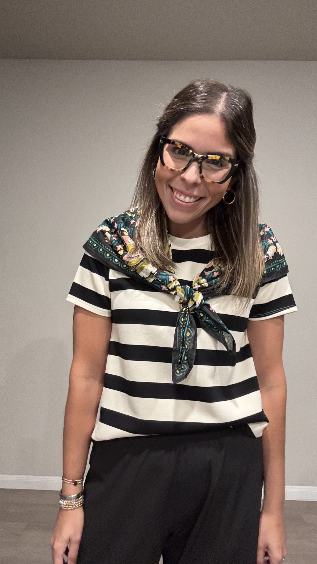 Pairing a classic black & white striped tee with wide-leg black trousers for an effortless silhouette, then tying it all together with a vintage-inspired floral neck scarf for a pop of pattern. Finished with magenta Mary Jane flats to add a punch of color to an otherwise monochrome base. Comfy, polished, and full of personality — perfect for a day that needs a little extra charm.

#OOTD #StripedTop #WideLegPants #MaryJaneFlats #ScarfStyling #EverydayElegance #LTKstyletip

#LTKmomlife #LTKMidsize #LTKWorkwear