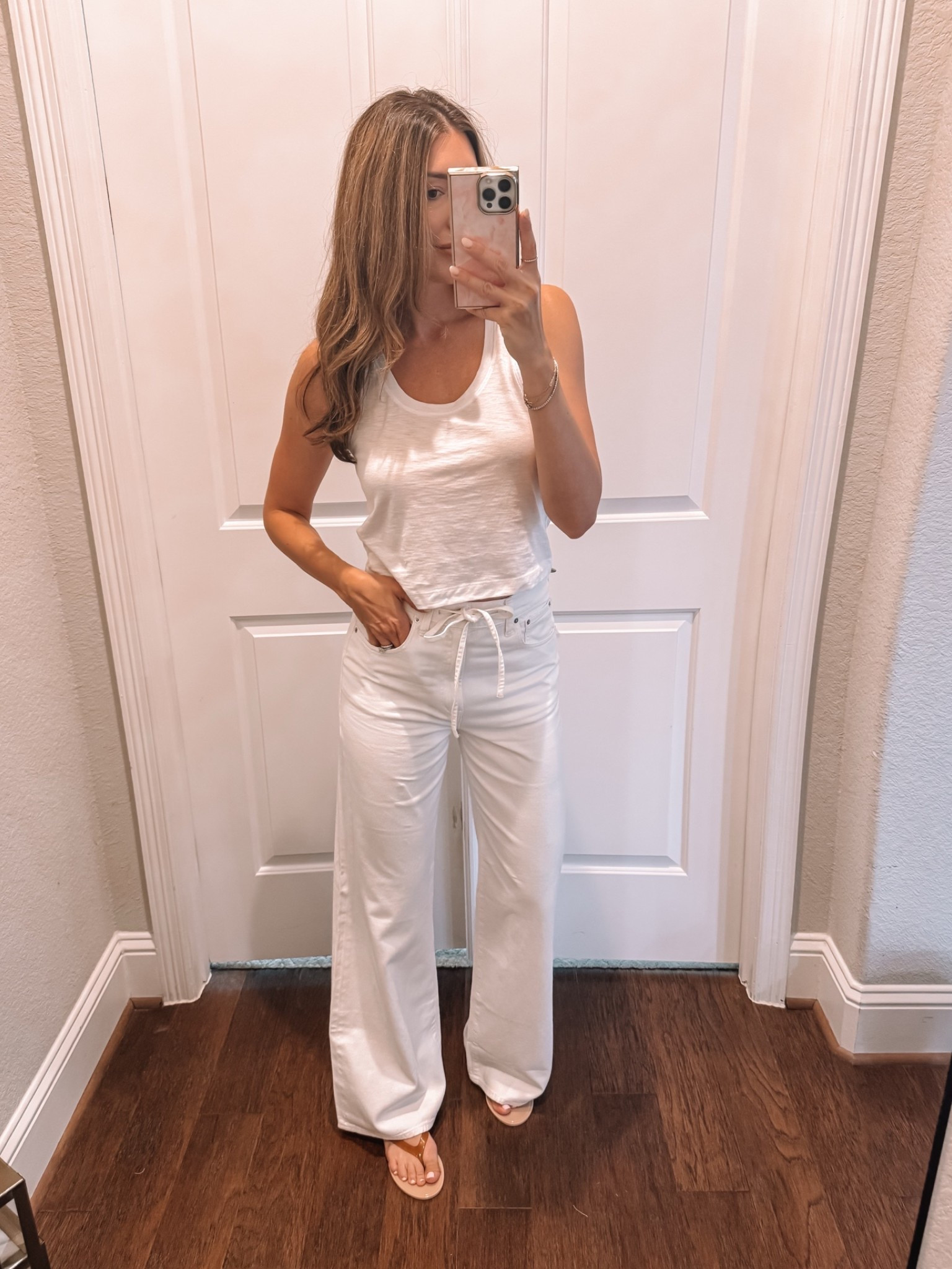 XS in tank, size 27 in jeans (sized up for slouchier fit)