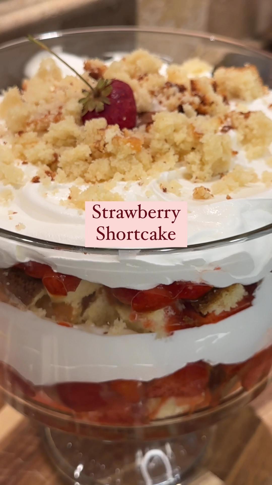 Strawberry Shortcake
Pound Cake:
1 cup butter, room temp
1 1/2 cups sugar
3 large eggs
1/2 cup sour cream
1/2 tsp vanilla
1 1/2 cup flour, sifted
1/4 tsp baking soda

Strawberry Layer:
2 packages (about 4-5 cups) of fresh strawberries, washed and diced
1/2 package fresh strawberries, sliced (if desired)
1/3 cup sugar
2 tbsp lemon juice
1 tsp vanilla
1 tbsp cornstarch 

Creamy layer:
Coolwhip

To make the poundcake: 
Preheat the oven to 350
Cream butter, sugar, and vanilla.
Add sour cream, mix until incorporated.
Sift baking soda and flour, and add to the mixture gradually, alternating with the eggs.
Butter a loaf pan, flour the inside of the pan and discard extra flour.
Pour batter into the pan, and bake for 40-60 minutes.
If the cake is browning too fast, add foil on top to continue cooking without browning.
Remove from the oven, cool for 30 minutes, then remove from the pan and let cool completely on a wire rack. 

Strawberry layer:
2 packages (about 4-5 cups) of fresh strawberries, washed and diced
1/3 cup sugar
2 tbsp lemon juice
1 tsp vanilla
1 tbsp cornstarch 

To make the Strawberry Layer:
1. Add the berries and sugar to a pot. Cook over medium, stirring frequently. 
2. Once the berries begin releasing their juices, add the lemon juice, vanilla and cornstarch. Stir constantly and let it bubble for 5-10 minutes. The berries will break down and it will begin to thicken. You still want to see pieces of the berries. 
3. Remove from the heat, let cool then transfer to the fridge until fully cooled. 

Assemble:
Slice and cube the poundcake, divide in half.
In a medium trifle dish or clear bowl layer half of the cubed pieces of poundcake. 
Top with half of the mixture of strawberries, and more fresh or frozen strawberries to your liking. 
Use one 8oz container of cool whip to cover and spread evenly over the strawberry layer.
Add a second layer of poundcake. Top with strawberries, cool whip. 
Crumble one piece of cake on top and garnish with one strawberry.
Refrigerate. Remove from the fridge 30 minutes prior to serving. 