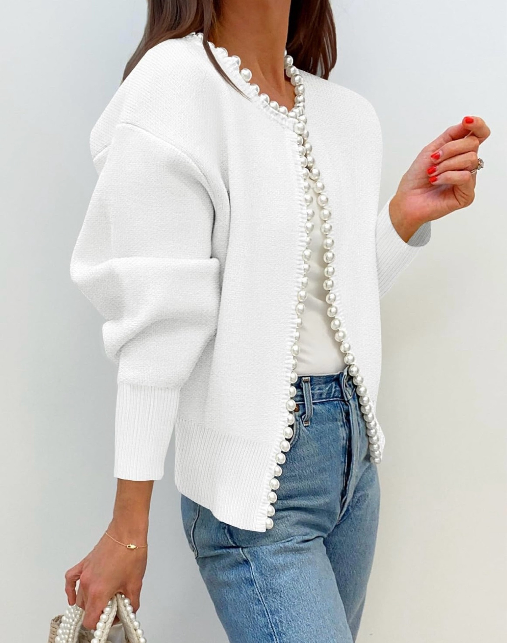Soft white with detailed pearls light sweater. Dress it up or wear with jeans. Top button for a different look. 

#LTKOver40 #LTKFindsUnder100