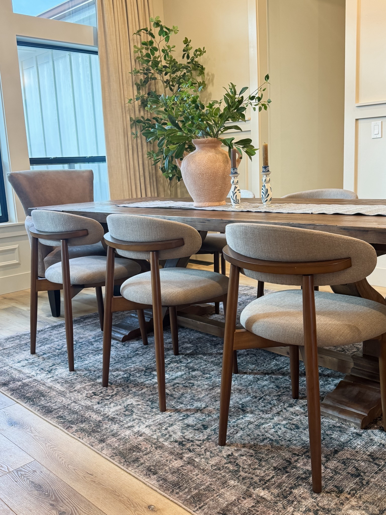 How pretty are the dining chairs?! Love the shape and walnut tone. 

#LTKHome