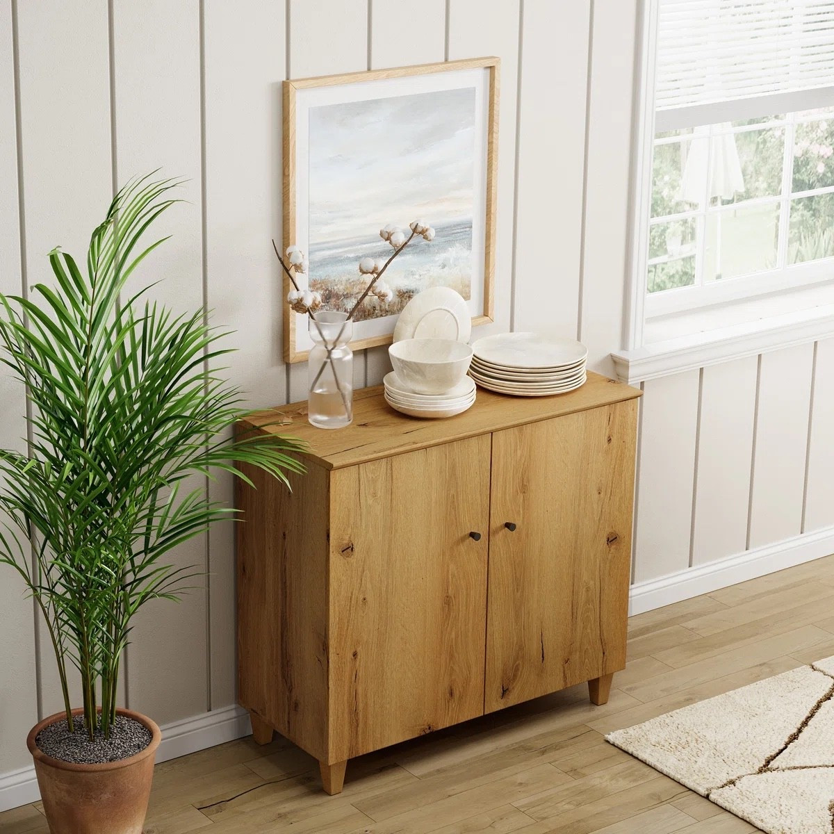 This wood accent cabinet from Wayfair is the perfect mix of storage and style. With its natural wood finish and clean design, it works beautifully in a dining room, entryway, or living space. Styled with framed art, ceramic dishes, and greenery, it creates a warm and inviting look. ✨ Plus, it’s currently on sale with an extra coupon, making it a great deal to grab now. 