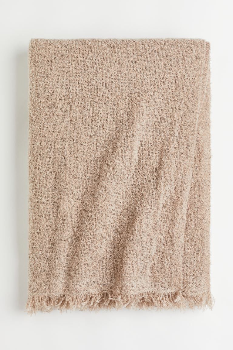 Throw in soft, woven bouclé fabric with wool content. Fringe at short sides.CompositionAcrylic 6... | H&M (US)