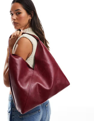 ASOS DESIGN slouch tote bag with crossover panel detail in burgundy | ASOS (Global)