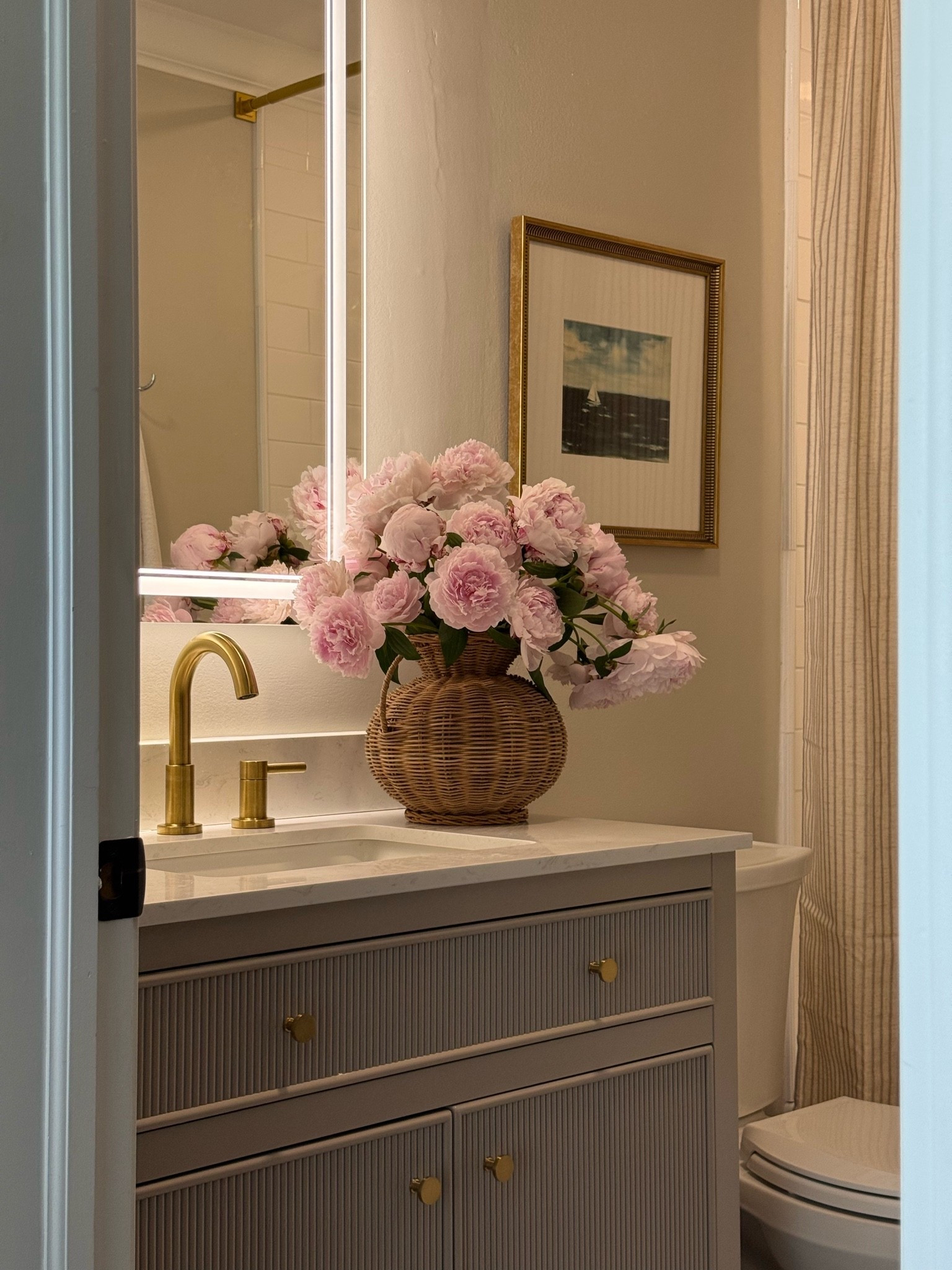 Guest bathroom art, shower curtain and woven vase details.

#LTKHome #LTKSaleAlert