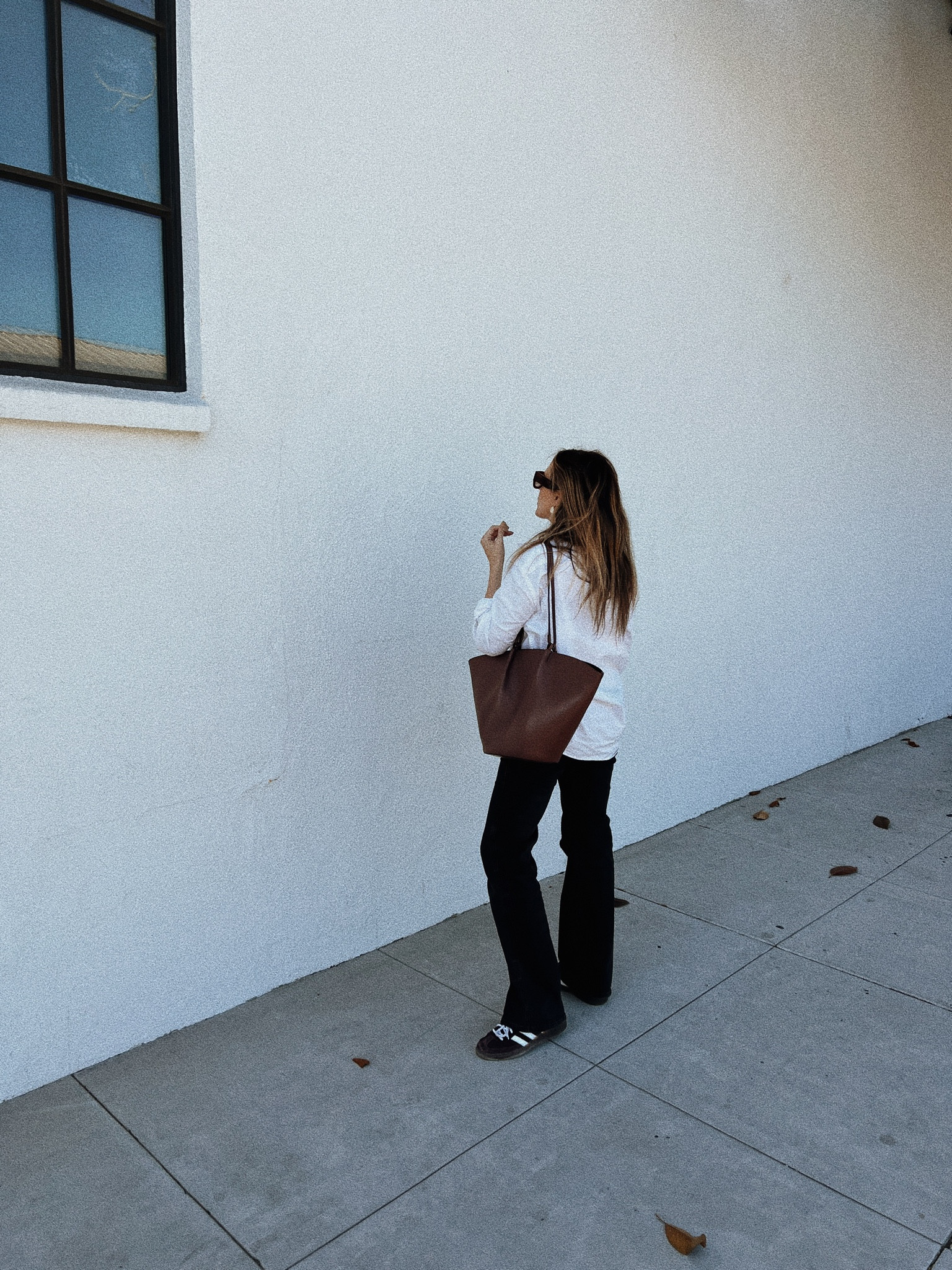 Easy and casual fall outfit idea- white button down, black jeans, chocolate brown tote and chocolate brown adidas 

#LTKshoecrush #LTKitbag #LTKSeasonal