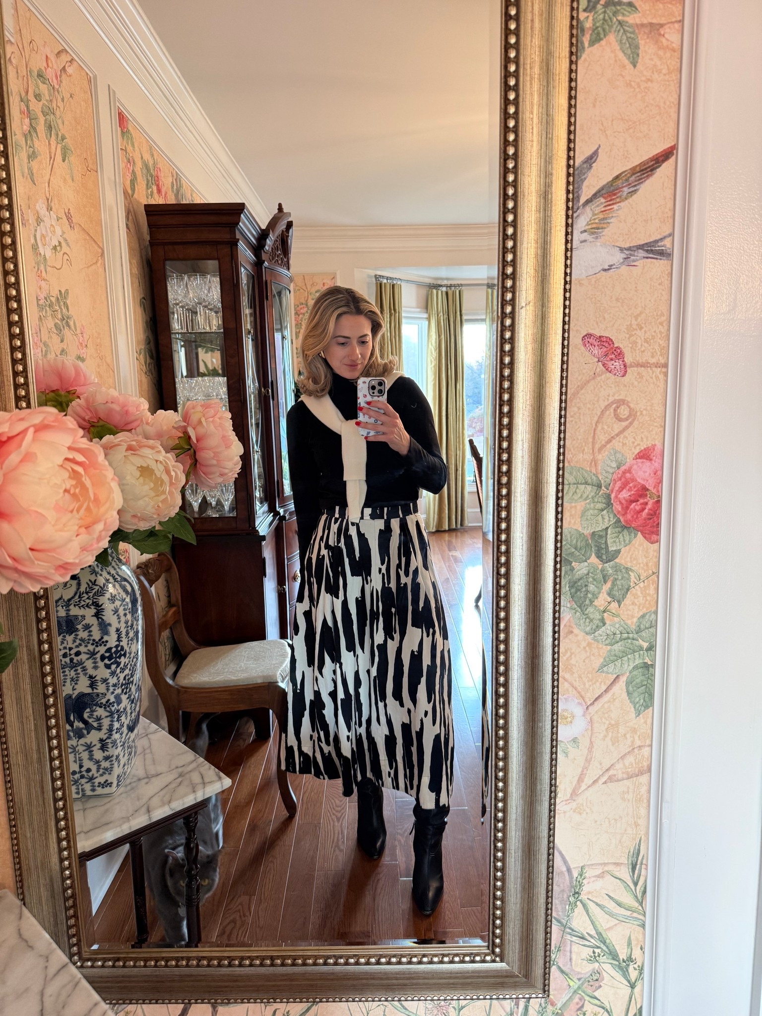 Elevated classics 🤍 A black knit paired with a statement black and ivory midi skirt and sleek black boots finished with a cashmere sweater tied over my shoulders for that effortless, tailored touch. I love adding a soft layer like this to make a simple outfit feel styled.

#LTKootd #LTKgrwm #LTKWorkwear