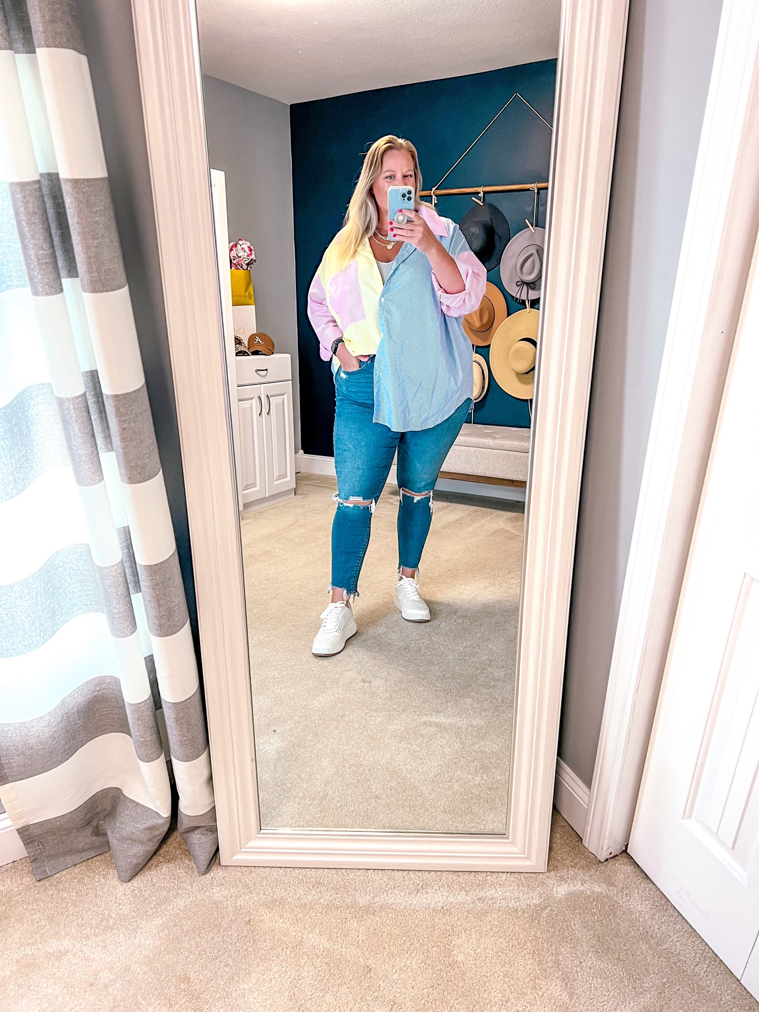 Spring is in the air and I cannot wait to get this striped button up back out. I am seeing lots of options for this style top and may have ordered another 🫣

Styled here with my favorite skinny jeans 👖 and platform sneakers. 👟 

I’m wearing a 34L (18 long) in the jeans. These have some stretch so fit TTs. 

#LTKover40 #LTKSpringSale #LTKplussize