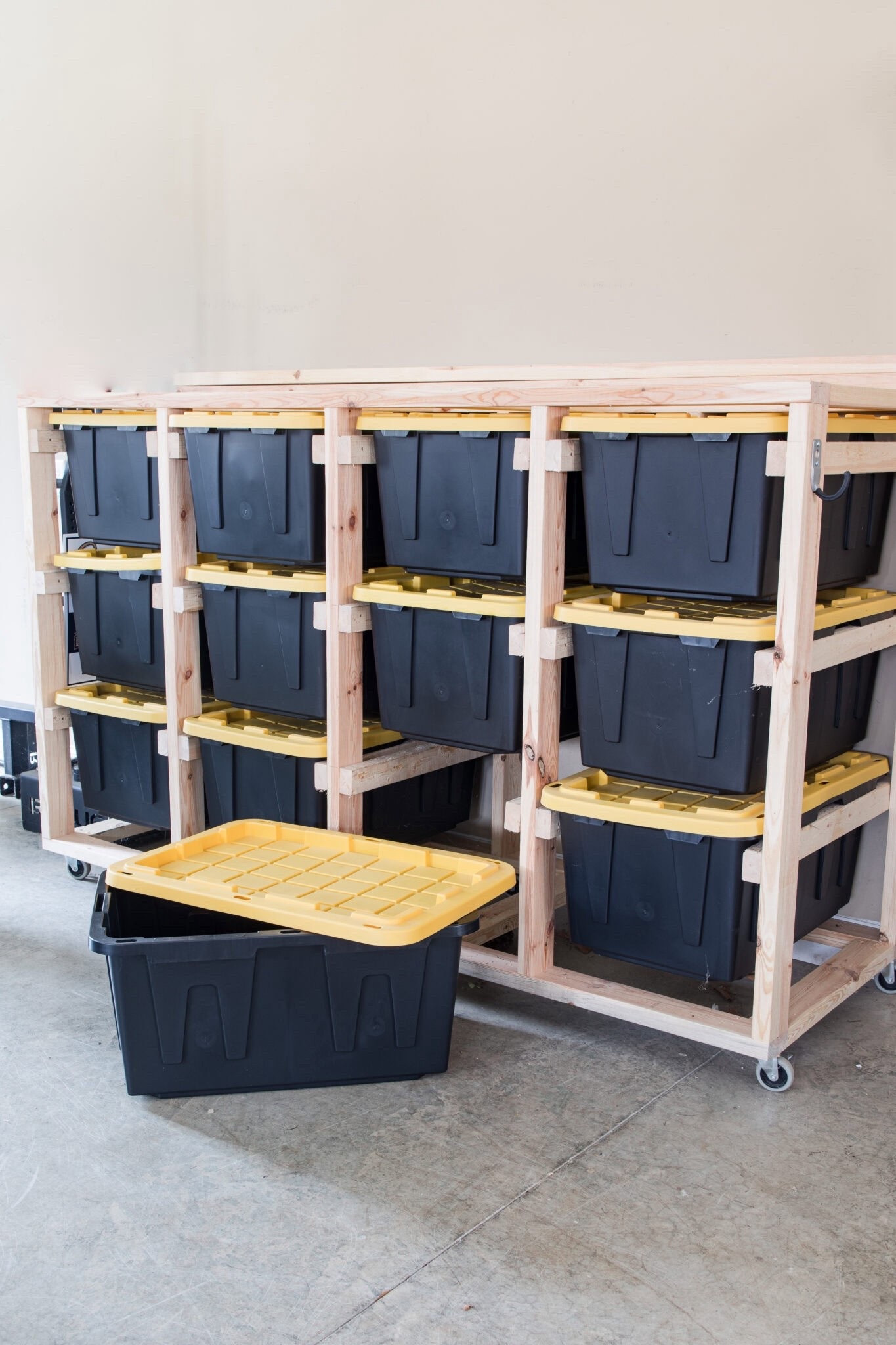 The best storage bins. Either buy a heavy duty storage shelf or build a wooden storage shelf using 2x4’s and adding wheels 
#lowespartner #ad @loweshomeimprovement

#LTKHome #LTKHoliday #LTKSeasonal