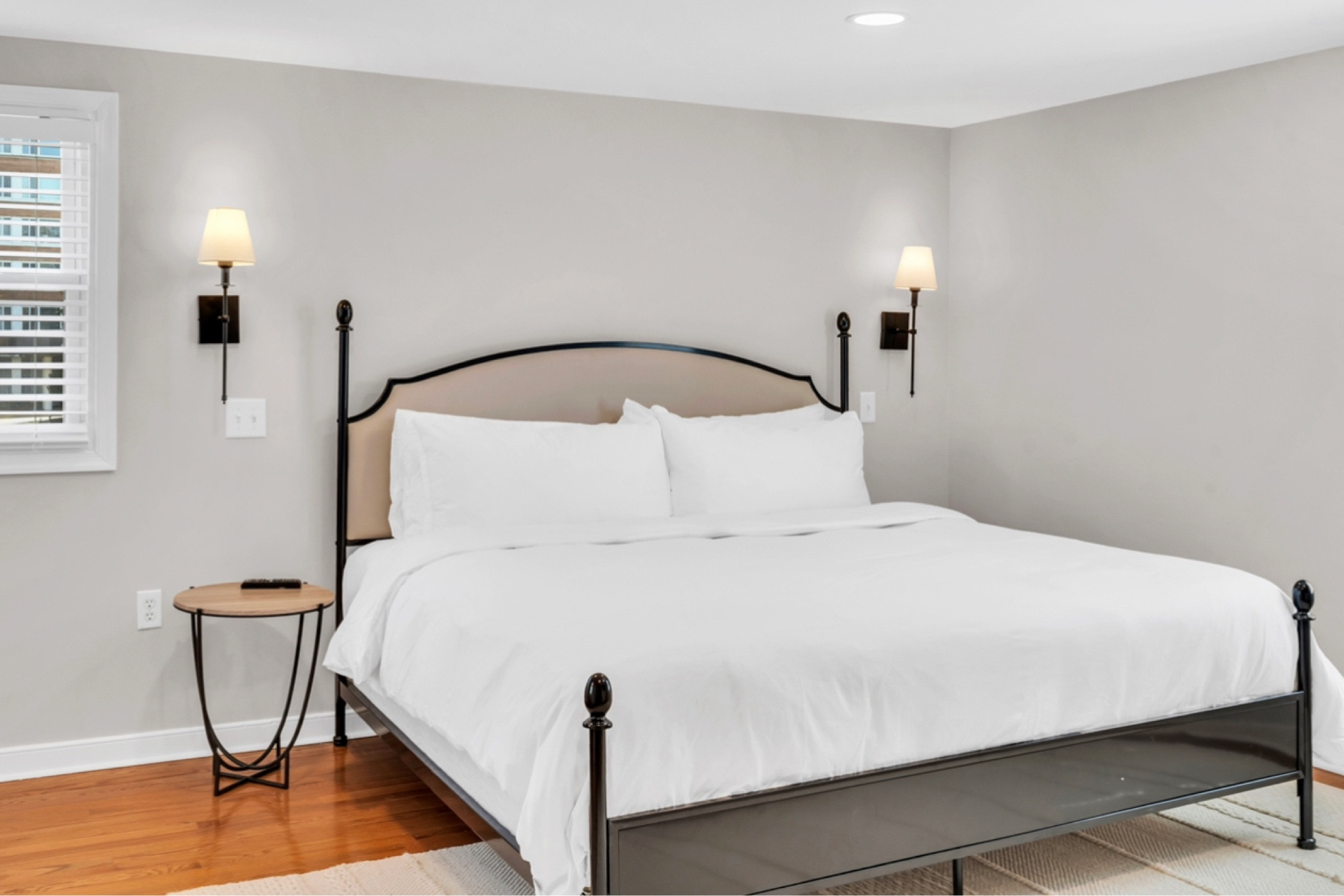 Wrought iron king bed with matching sconces in our Airbnb. Affordable room design 

#LTKhome