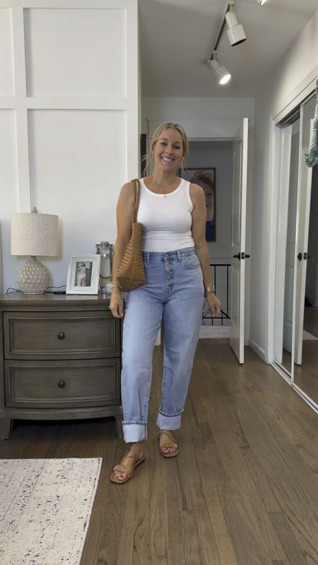 Obsessed with this outfit. The tank is full stretch and SO comfy/flattering. Not see through and long enough for longer torsos or to tuck! I’m in a small so size down if in between. Jeans are tts; I’m in a 29 regular length and finally found a perfect inseam! They’re 30” when down but I do love them cuffed too which is great bc it gives them such versatility! Sandals are 25% off with code LONGWEEKEND and I love everything so much!! Jeans hold in the lower belly and make the booty look adorbs! 

#LTKMidsize #LTKStyleTip #LTKSaleAlert