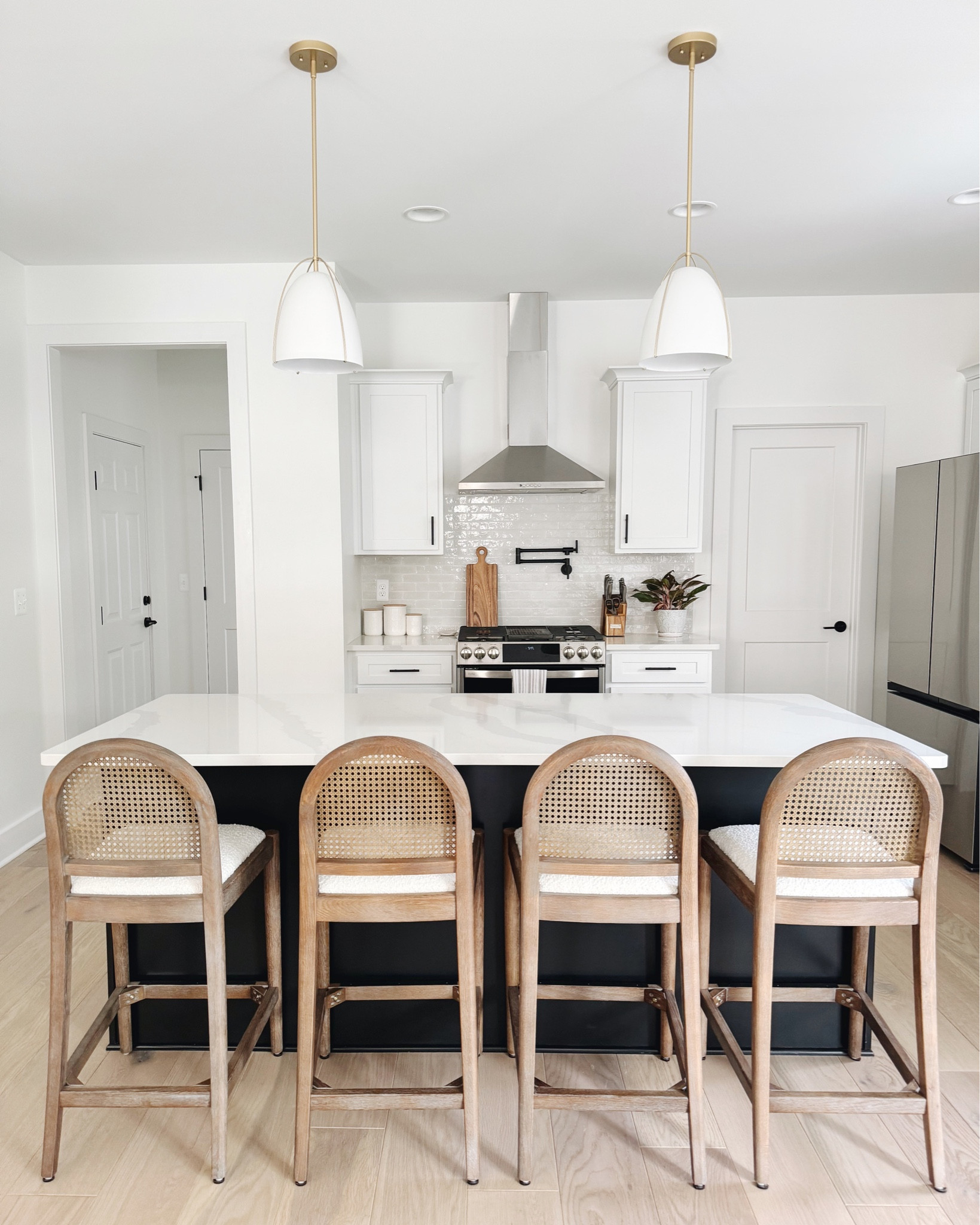 My friends did such a good job picking out their home finishes with their builder so helping them tie everything together with these counter stools & light fixtures was easy! 

#LTKHome #LTKSeasonal #LTKFamily