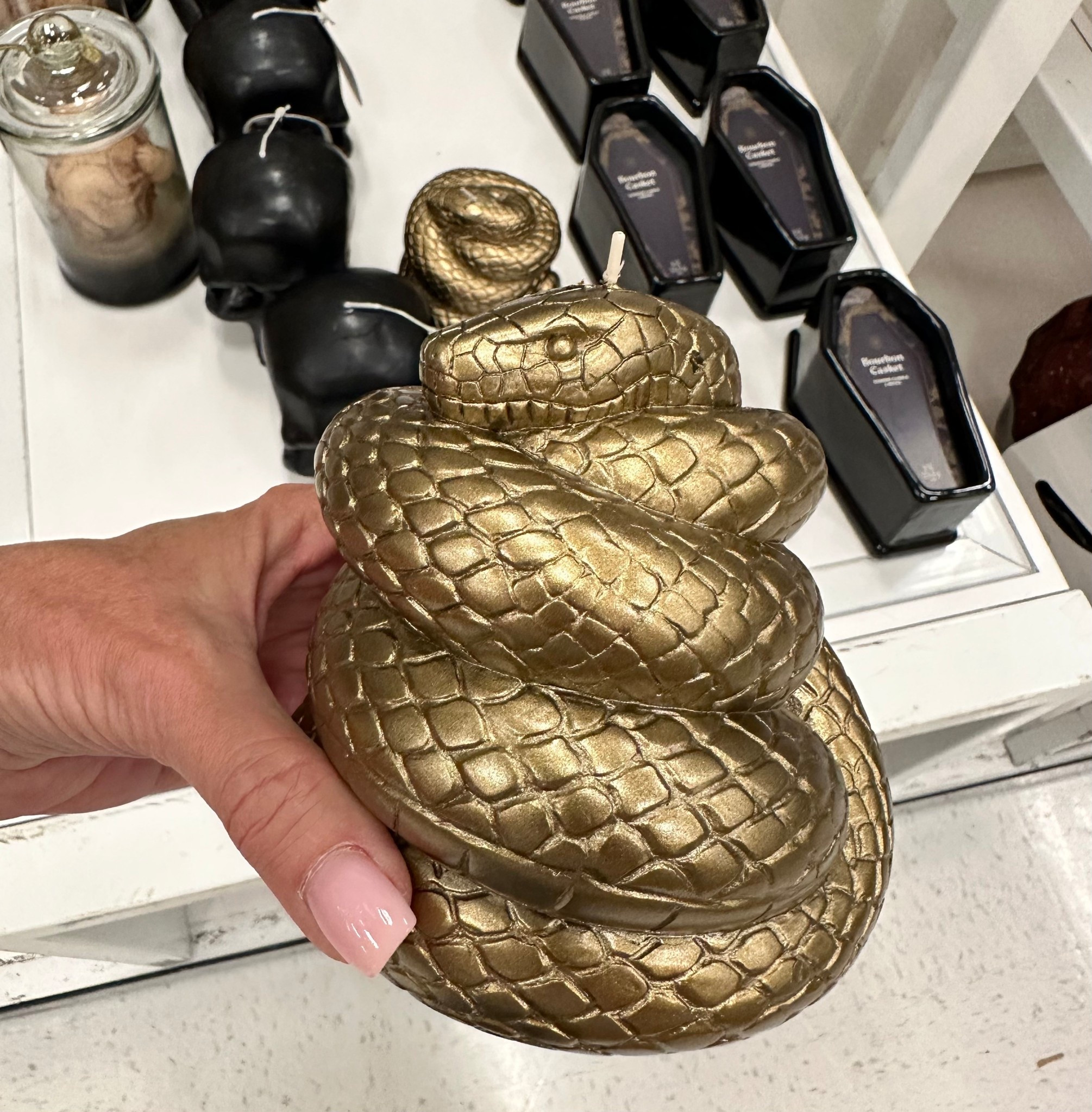 Gold snake candle for Halloween Decor 

#LTKStyleTip #LTKSeasonal #LTKHome