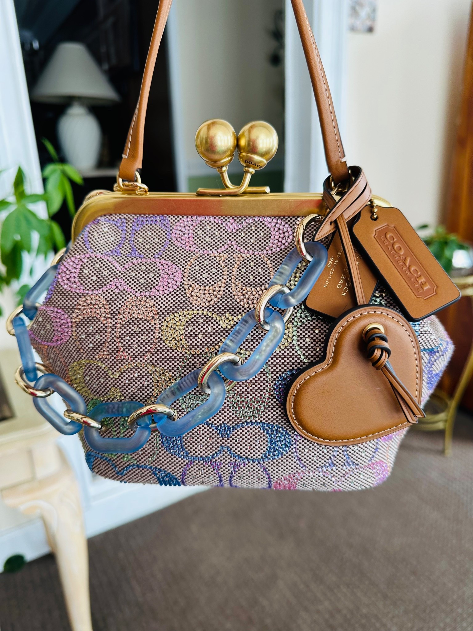 This Coach Crystal Kisslock 16 is 🔥🔥🔥Don't let the small size fool you! It holds a LOT! Get it quick before it sells out! 