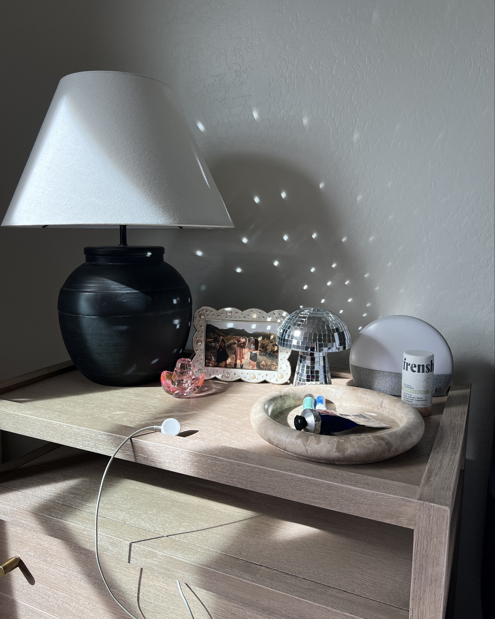 Your nightstand is the first thing you see in the morning and the last thing you see before going to bed. That being said, you should decorate it with things that make you happy!! I love my girly nightstand. 🪩🤠🩷

Feminine. Girly decor. Simple. Neutral style. Pop of color.

#LTKMostLoved #LTKHome #LTKStyleTip