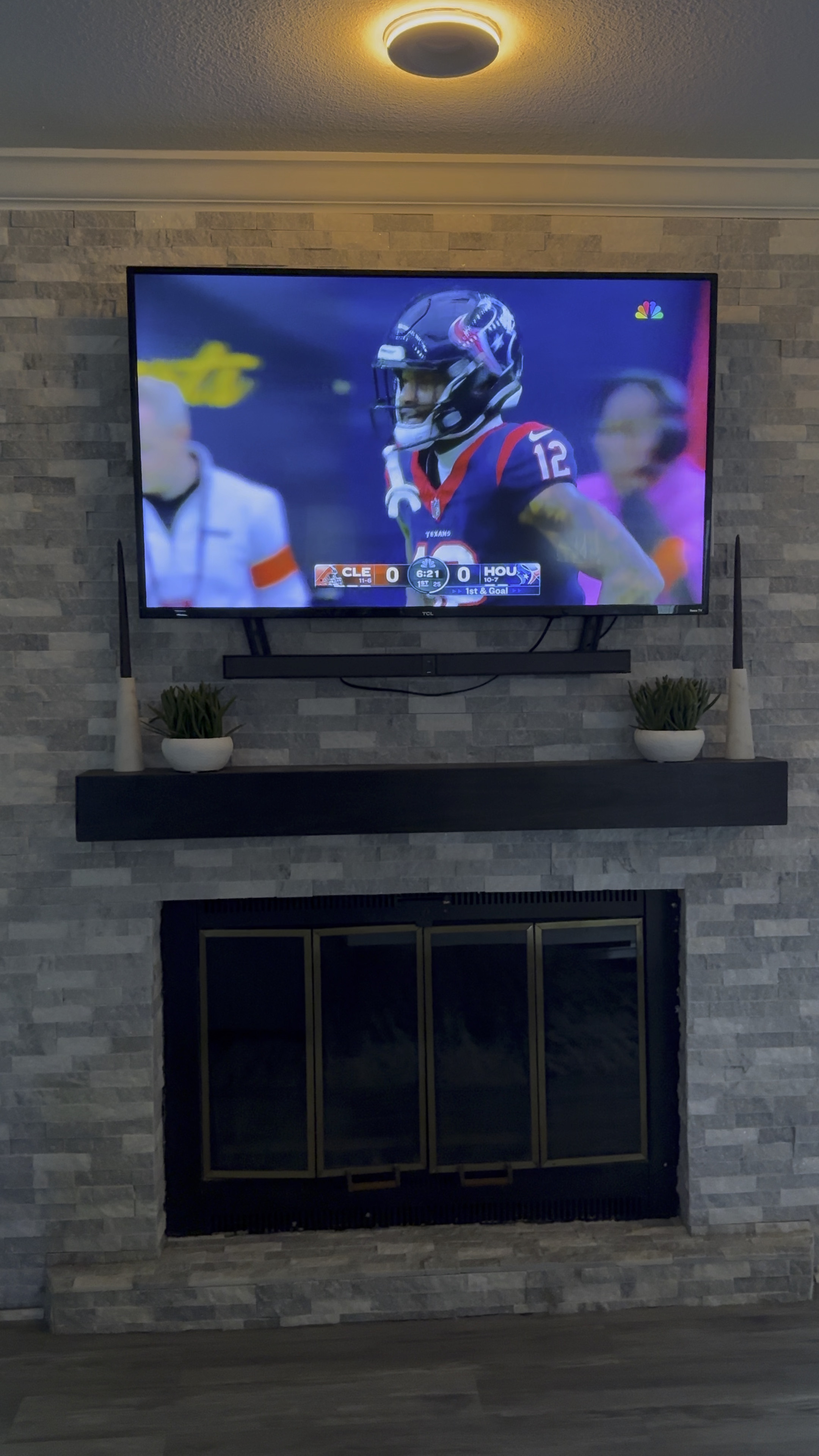 Modern fireplace and TV Area. Alaskan Grey stone found at Home Depot creates a very cool, sleek, upgraded back drop for fireplace. Black modern farmhouse mantle from wayfair styled with succulents and black dipped candles from crate and barrel sit perfectly on top! 

#LTKVideo #LTKstyletip #LTKhome
