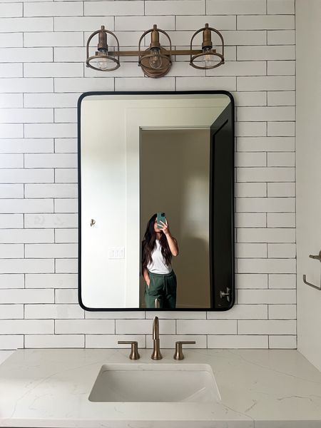 One of the kids bathrooms. I love the organic flow of the subway tile and the industrial light fixture.

#LTKHome #LTKStyleTip