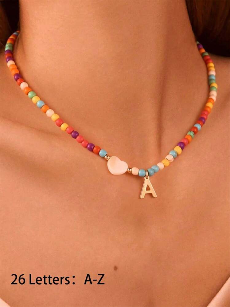 1pc Elegant Teenage Girl Style Gold Stainless Steel 26 Letter Pendant With White Heart Pendant And Colorful Plastic Bead Necklace, Initial Necklace Suitable For Gifts To Girlfriends, Classmates And Friends, Suitable For Street And Travel Accessories | SHEIN