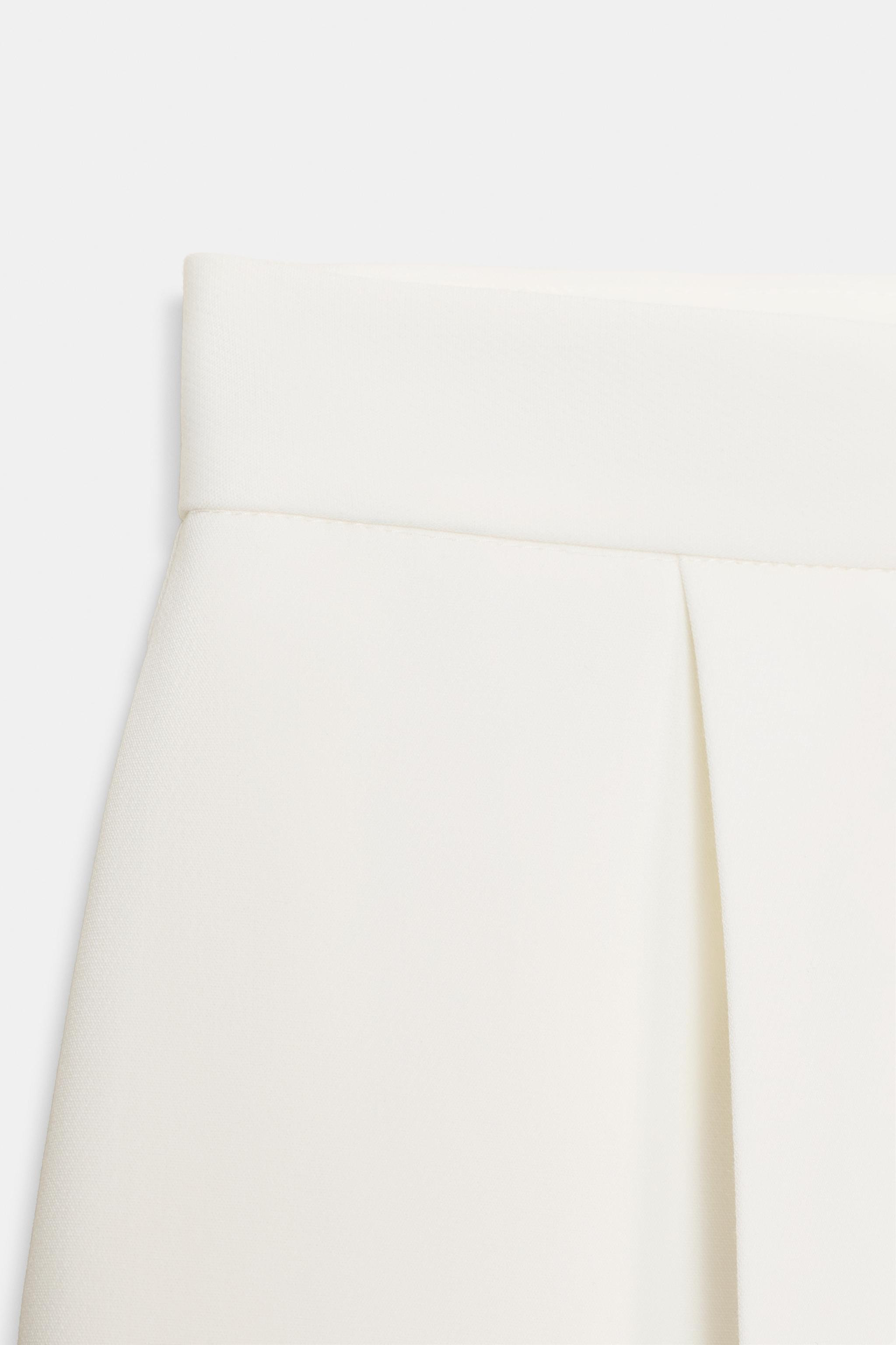 High-waist trousers with front darts. Featuring front pockets and false flap pockets at the back.... | Zara UK