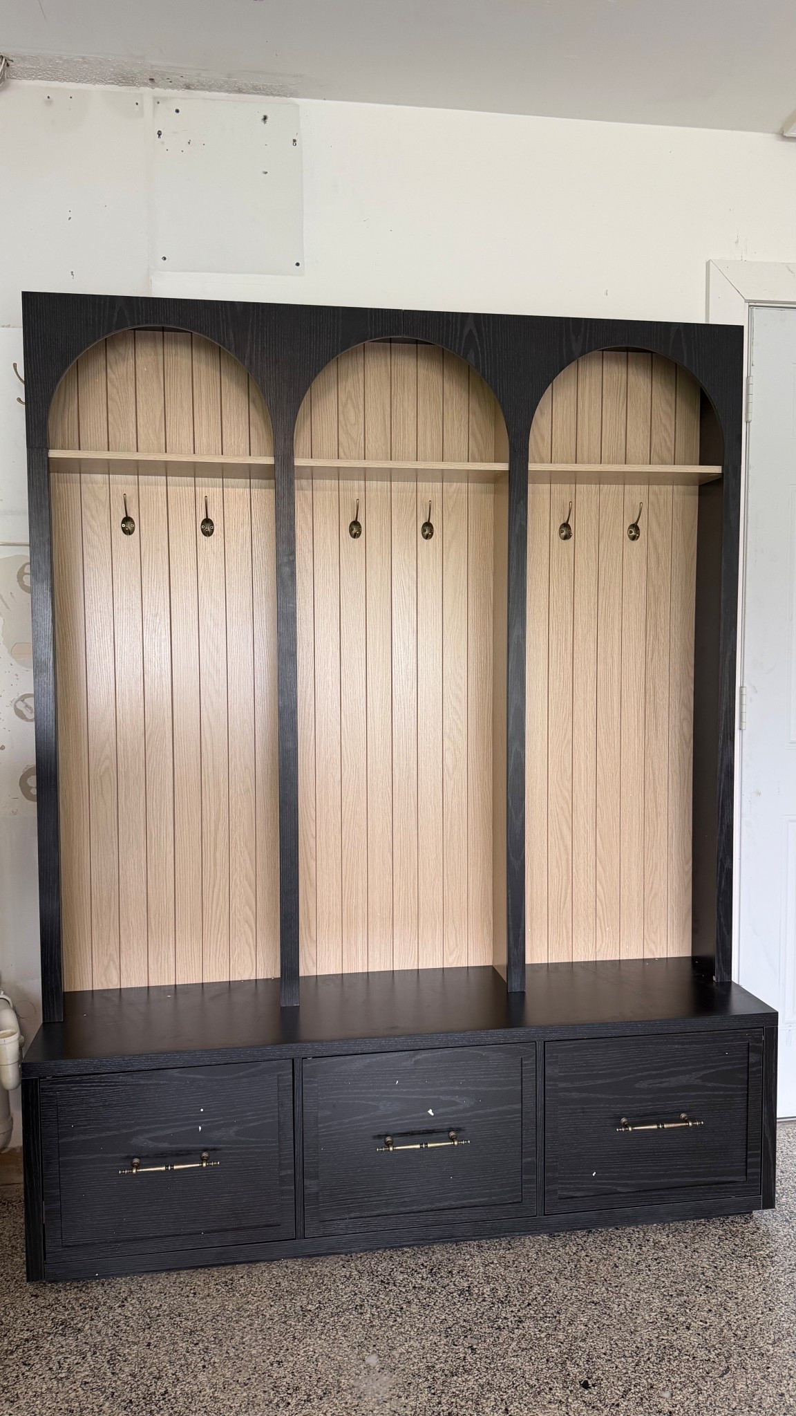 This built-in mudroom moment turned out so good 🤎 I love how the arched design adds character while still being super functional for everyday life with kids. Each cubby has hooks for backpacks and jackets, a bench for shoes, and drawers for all the things that usually end up on the floor. Practical storage but make it pretty. If you’re designing a mudroom or entryway, arches + warm wood tones + dark cabinetry are such a timeless combo.

#mudroom #mudroomdesign #mudroominspo #builtins #builtinstorage #entrywaydesign #entrywayinspo #homeorganization #homeorganizationideas #custombuiltins #archdesign #archedbuiltins #moderntraditional #moderntraditionalhome #studiomcgee #studiomcgeestyle #homeinspo #interiordesigninspo #homeprojects #homeupgrades #storageideas #familyhome #momlifeorganization #organizedhome #entrywaystorage #mudroomstorage #benchstorage #homeimprovement #neutralhome #customcabinetry

#LTKHome #LTKmorningroutine #LTKmomlife
