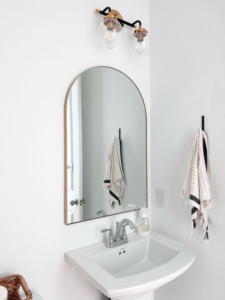 Love this new arch mirror we added to our powder bath. And this mirror is affordable 

Brass arch mirror / gold arch mirror / powder bath / 

#LTKhome #LTKstyletip