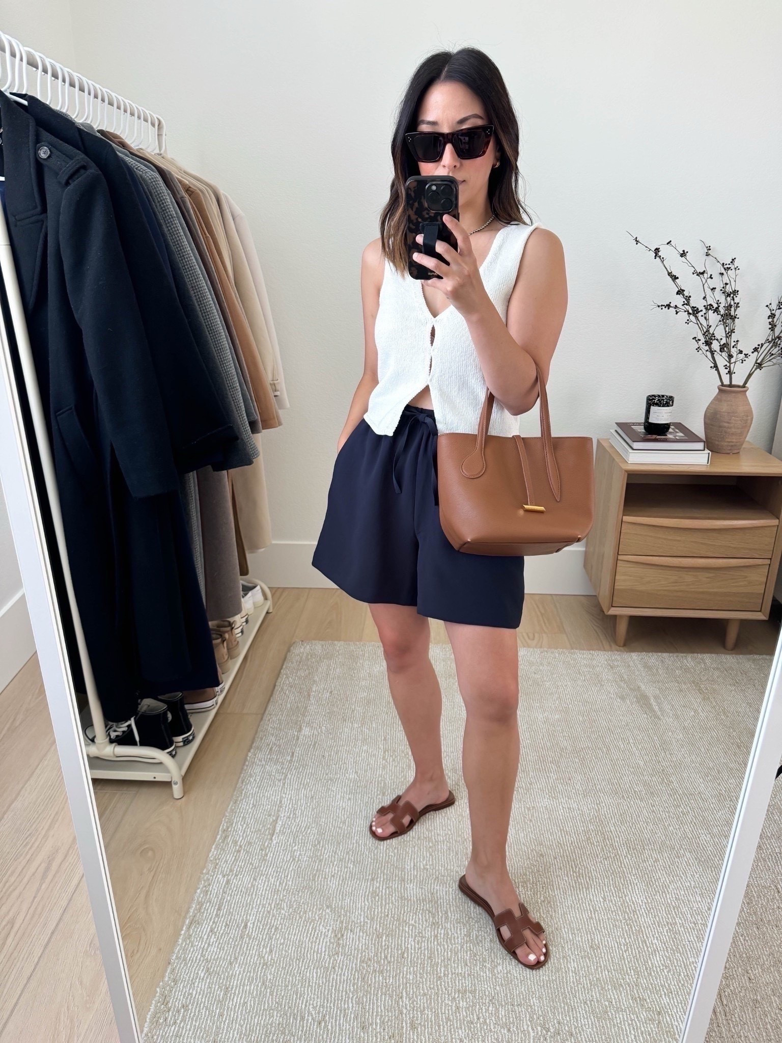 Aritzia knit tank is perfection! Cannot recommend this enough. I'm wearing an xs here, but prefer the small. Also, these are pull on style trouser shorts with a longer length. So, so elevated. I'm in the small

Aritzia knit tank xs. But need the small
Aritzia shorts small
Hermes Oran sandals 35
Liffner bag
Celine sunglasses
Dorsey James necklace 15"
J.Crew earrings

Summer outfits, summer style, petite style 

#LTKSeasonal #LTKootd #LTKPetite