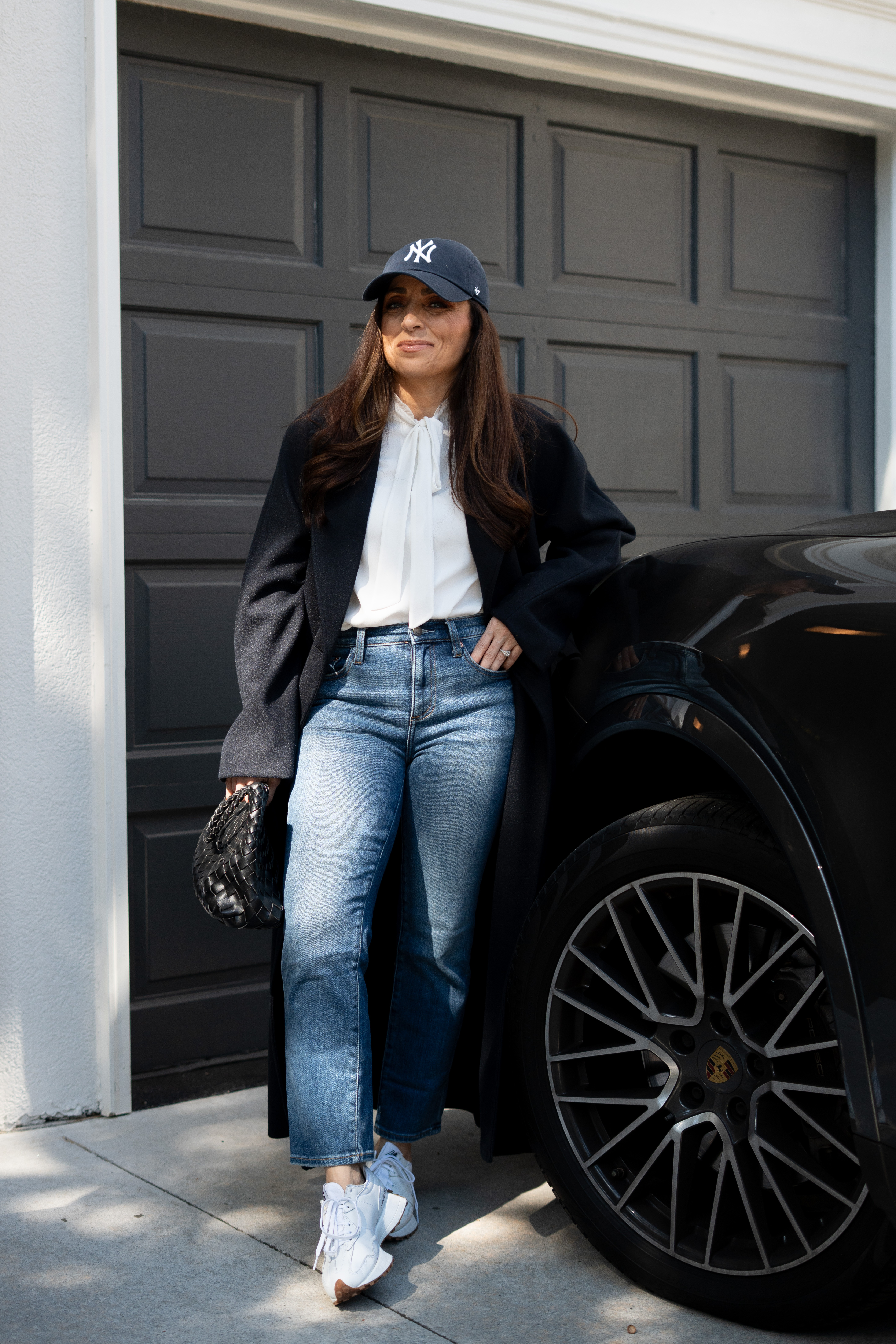 Wait… how is this outfit so easy and so good?! Threw on my Yankees cap last minute and it totally made the look feel intentional. The white blouse keeps it light and flowy, while the structured coat adds just the right amount of drama. Straight jeans, clean sneakers, and my fave clutch—done and done. It’s giving city stroll, coffee run, spontaneous dinner vibes all in one! 

 #LTKSeasonal #LTKFindsUnder100 #LTKStyleTip