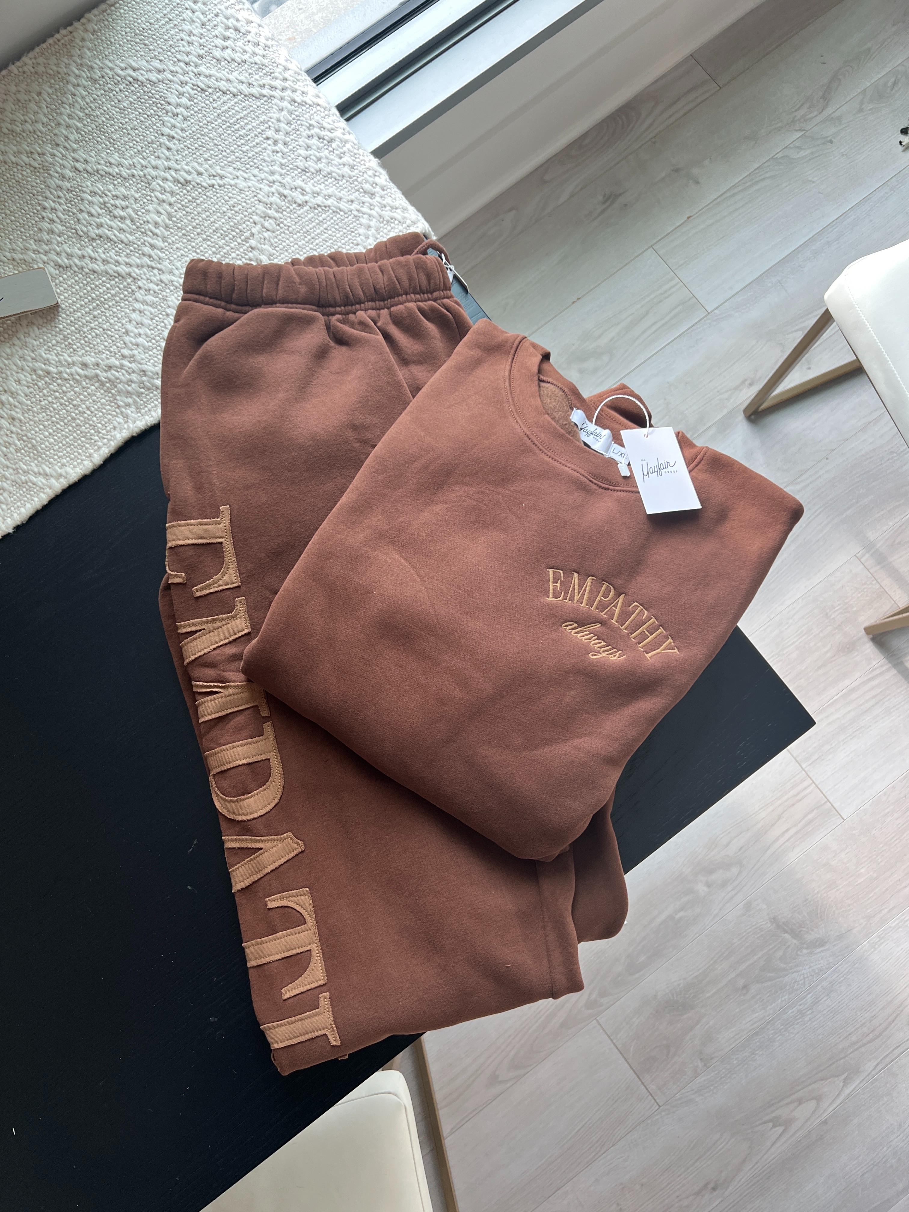 Nothing cozier than a sweatsuit set from The Mayfair Group, love the EMPATHY embroidery on this crewneck and jogger. 

 #LTKSeasonal #LTKActive #LTKHome
