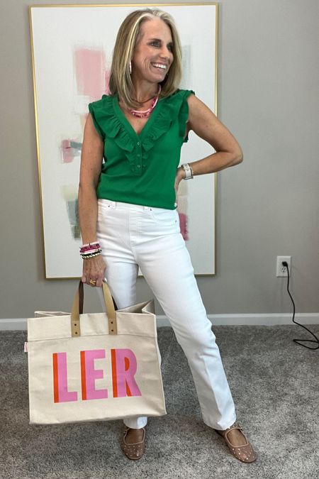 I’m loving green for spring and summer and this top is so cute. I have it in black also. Wearing XS (code LISA10)

Spanx kick flare jeans. These are supposed to be a little cropped but I’m in a regular and they’re a normal length. I’m 5’3. Wearing small. Use code LISAXSPANX 

New jewelry from Allie +Bess. Use code COAST20 for 20% off 

Bag is 20% off this weekend 

#LTKfindsunder100 #LTKover40 #LTKtravel