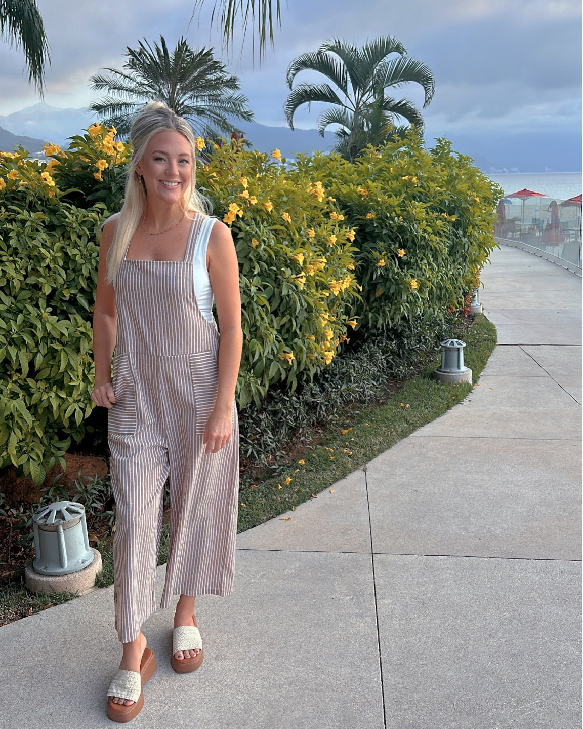 Could this be my favorite outfit from the whole trip?! 🙌🏼🫶🏼 

Use code ASH20 for 20% off this entire outfit! 🛍️ 

This jumpsuit could not be more comfortable and flattering! I love its relaxed but polished look & paired with a simple body suit it’s a home run! 

White tank bodysuit: small TTS
Striped taupe jumpsuit: small TTS
Platform sandals: 7 TTS 

#LTKtravel #LTKfindsunder50 #LTKSpringSale