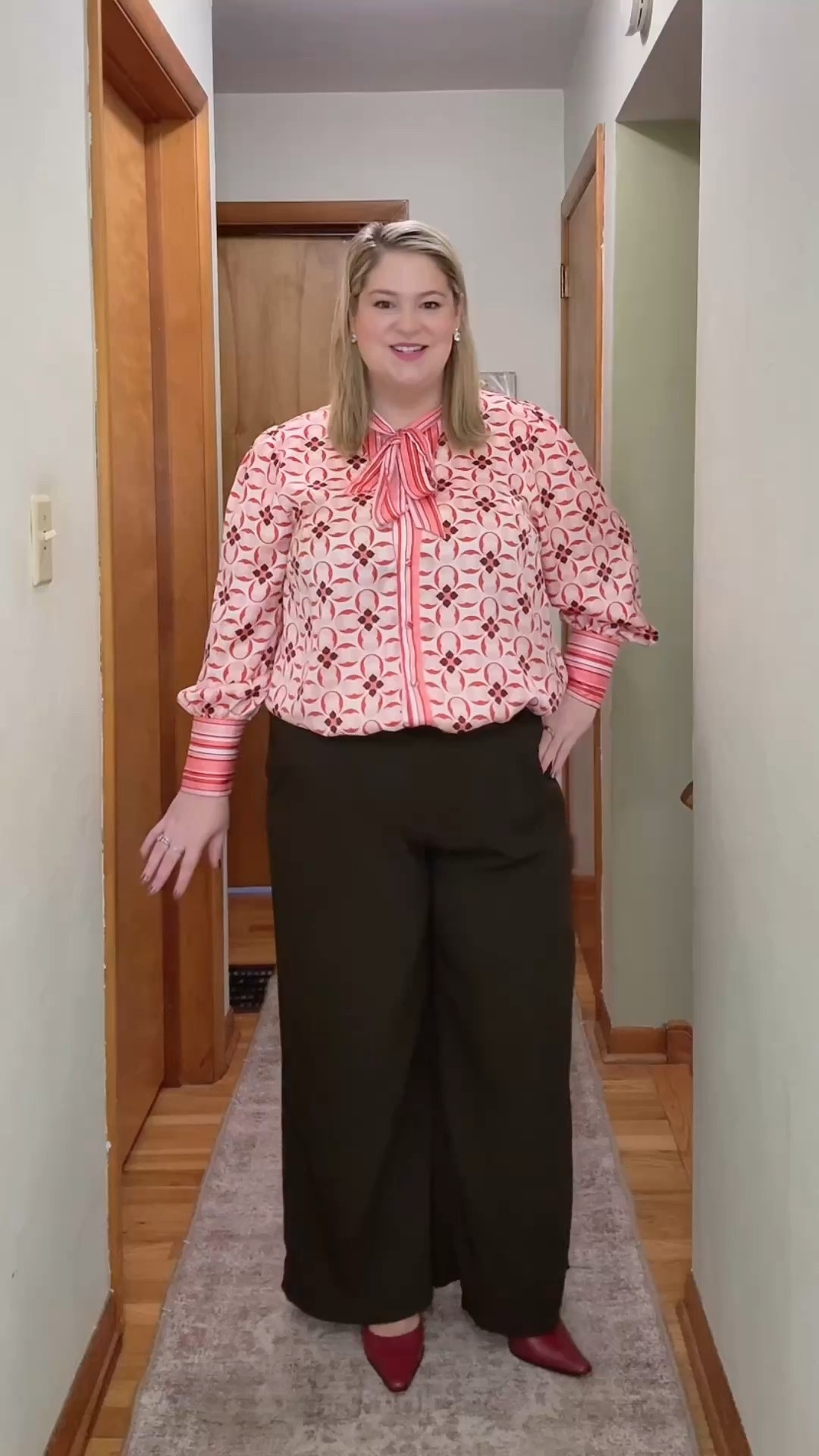 Realistically Dessing for enjoyment, confidence, and fun! My pink bow tie “Circus” shirt 🎪, cherry heels, and pretty details for a facilitation day. I’m curious do you like to wear patterns? #midsize #plussize #curvyfashion #officeootd 