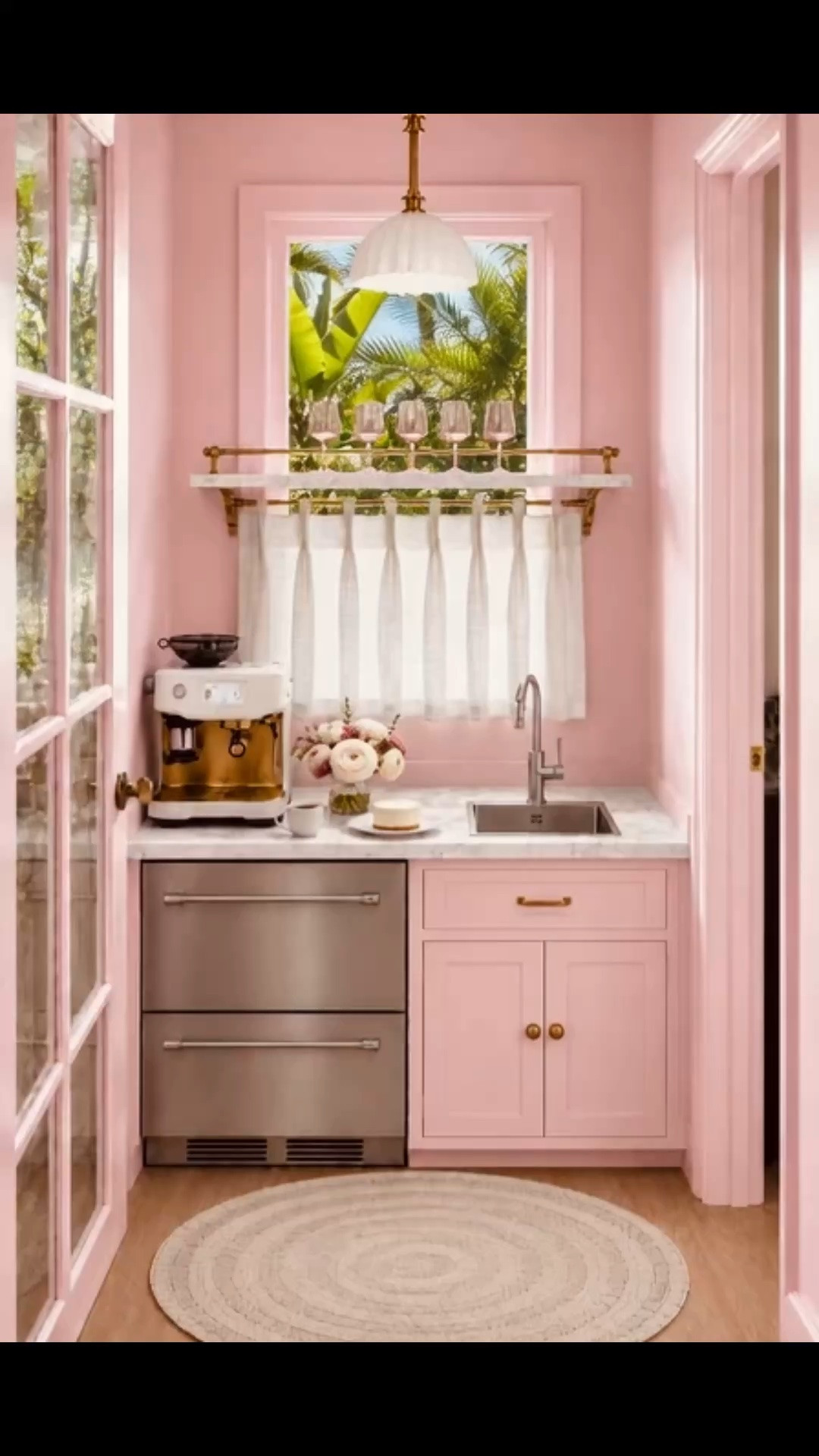 An afternoon coffee moment, wrapped in the most beautiful rose pink. 🌸☕️

The undercounter drawer refrigerator keeps milk, cream, cold drinks, and coffee essentials organized and within easy reach, while the compact bar sink makes filling the espresso machine, rinsing cups, and cleaning up effortless—creating a fully functional coffee station in one beautifully designed space.

The marble-and-brass rail shelf frames the window without blocking the natural light, adding architectural interest and an elegant place to display the pink fluted glassware. A tailored linen café curtain softly filters the afternoon sunshine, bringing privacy, texture, and a romantic sense of depth.

Underfoot, the Serena & Lily round woven rug makes the room feel relaxed and inviting, while its intricate woven pattern adds a sophisticated finishing touch.

Shop the undercounter drawer refrigerator, bar sink, espresso machine, rail shelf, café curtain, glassware, lighting, rug, and coffee-station essentials.

#LTKHome #AfternoonCoffee #CoffeeStation #DrawerRefrigerator #UndercounterFridge #BarSink #CafeCurtain #RailShelf #EspressoMachine #PinkKitchen #HomeCafe #SerenaAndLily #RoundRug #KitchenDesign #InteriorDesign

#LTKdayinmylife #LTKHome