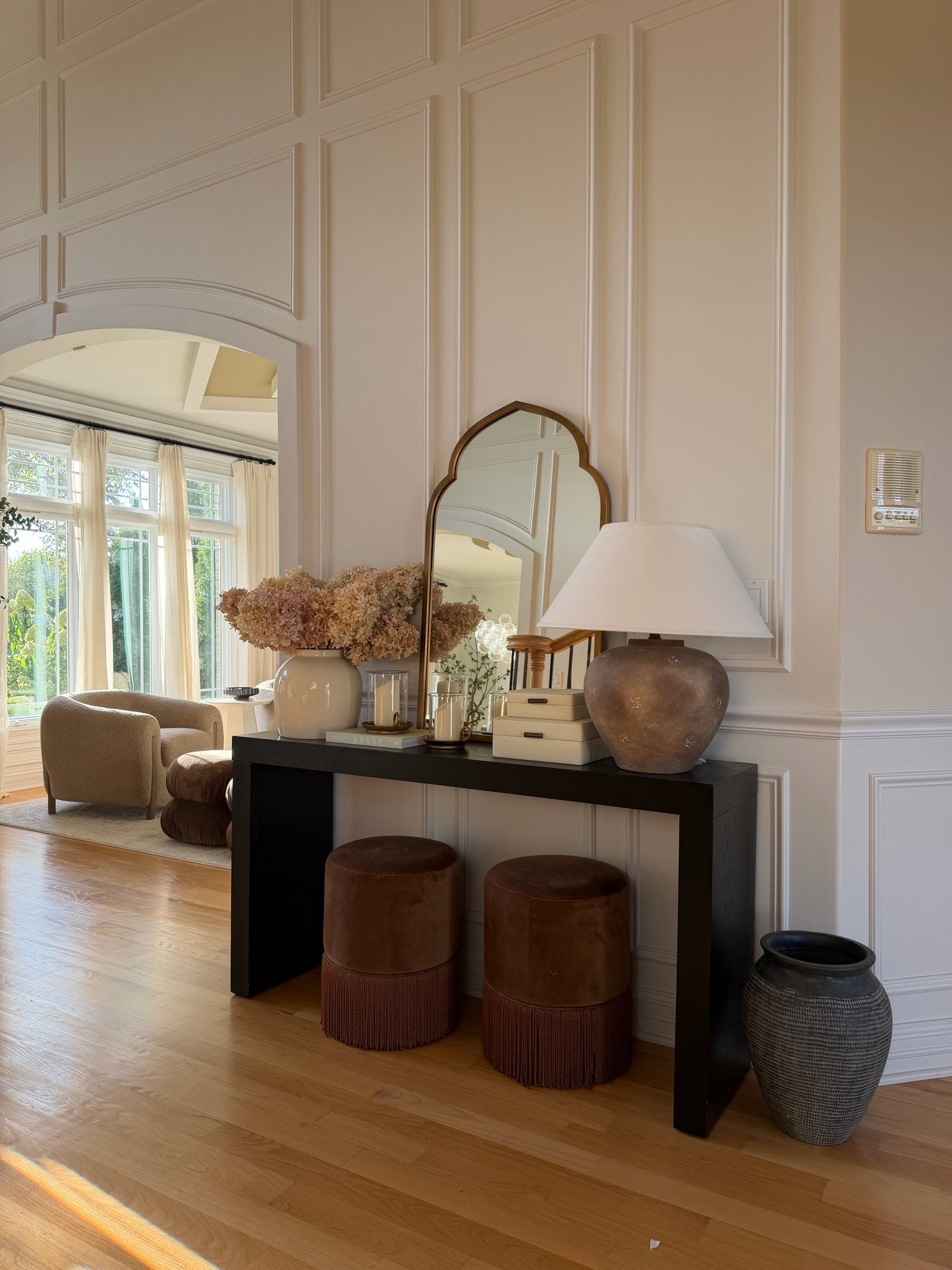 A subtle entryway refresh for fall 🤎 Warm brown tones, dried hydrangeas, soft lighting + layered textures for a cozy seasonal feel without going overboard. Linking all the details from this space! 🍂

#LTKHome #LTKSeasonal