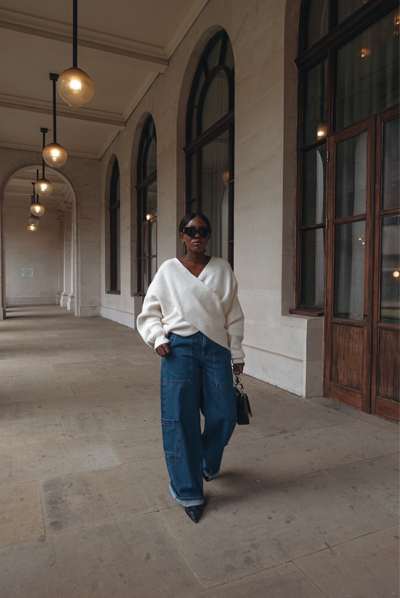 Wrap knit top and cargo jeans 

#LTKSeasonal #LTKeurope #LTKSpringSale