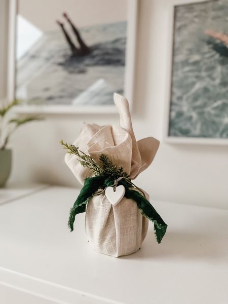 How to wrap small objects that are difficult to wrap with paper! FABRIC is a great alternative! 👌🏻 I’m using a linen-like fabric I grabbed at my local fabric store to wrap the candles from my QVC line (great hostess gift, and they’re on sale for under $20 for 4!). Burlap is inexpensive and works well, too! And just a reminder - this series is to inspire you if you’re looking for it! A gift bag is totally fine too 🤣🤣

#LTKHoliday