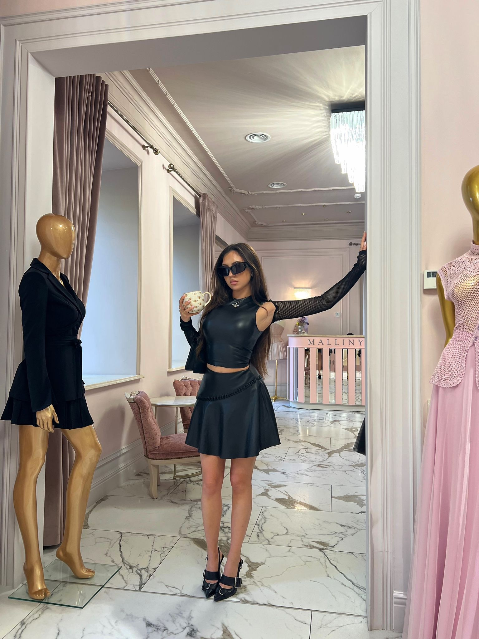 Oversized black sunglasses, leather look top, faux leather skater skirt, pleated mini skirt, fish net shrug cover up, pointed buckle heels, skims, PLT 

#LTKeurope #LTKSeasonal #LTKstyletip