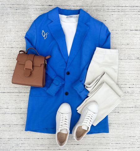 Smart casual workwear with blue blazer paired with white knit top and cream work pants. Accessorized with white sneakers and earrings for a chic look. Perfect for more casual workwear or teacher outfits! 

#LTKSeasonal #LTKstyletip