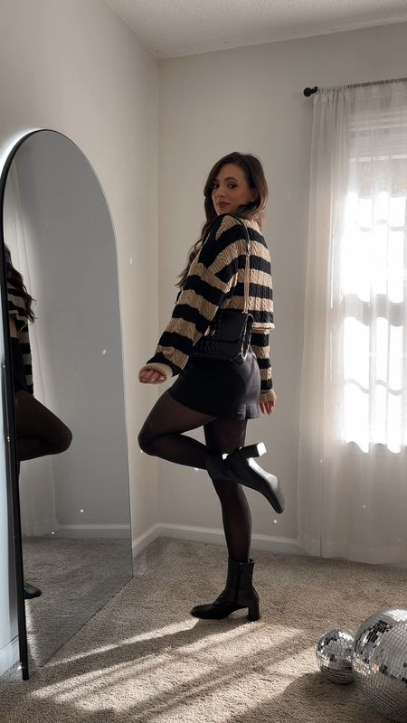 Winter outfit, fall outfit, striped sweater, cable knit, skort, black tights, boots 

#LTKSeasonal #LTKshoecrush