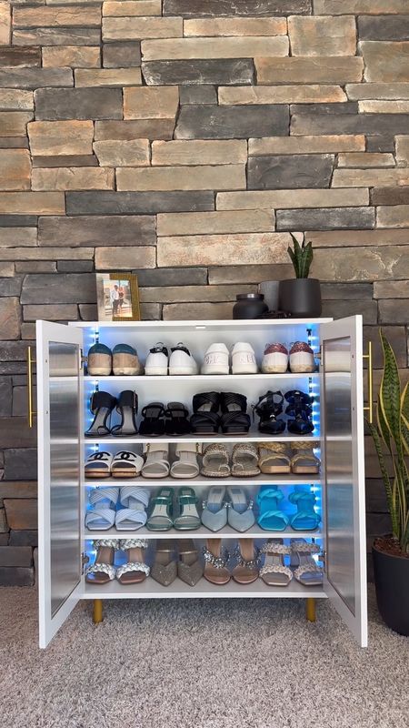 Shoe cabinet for extra storage with led lights. Holds 22 pairs of shoes and makes them so easy to access and so much more organized!  