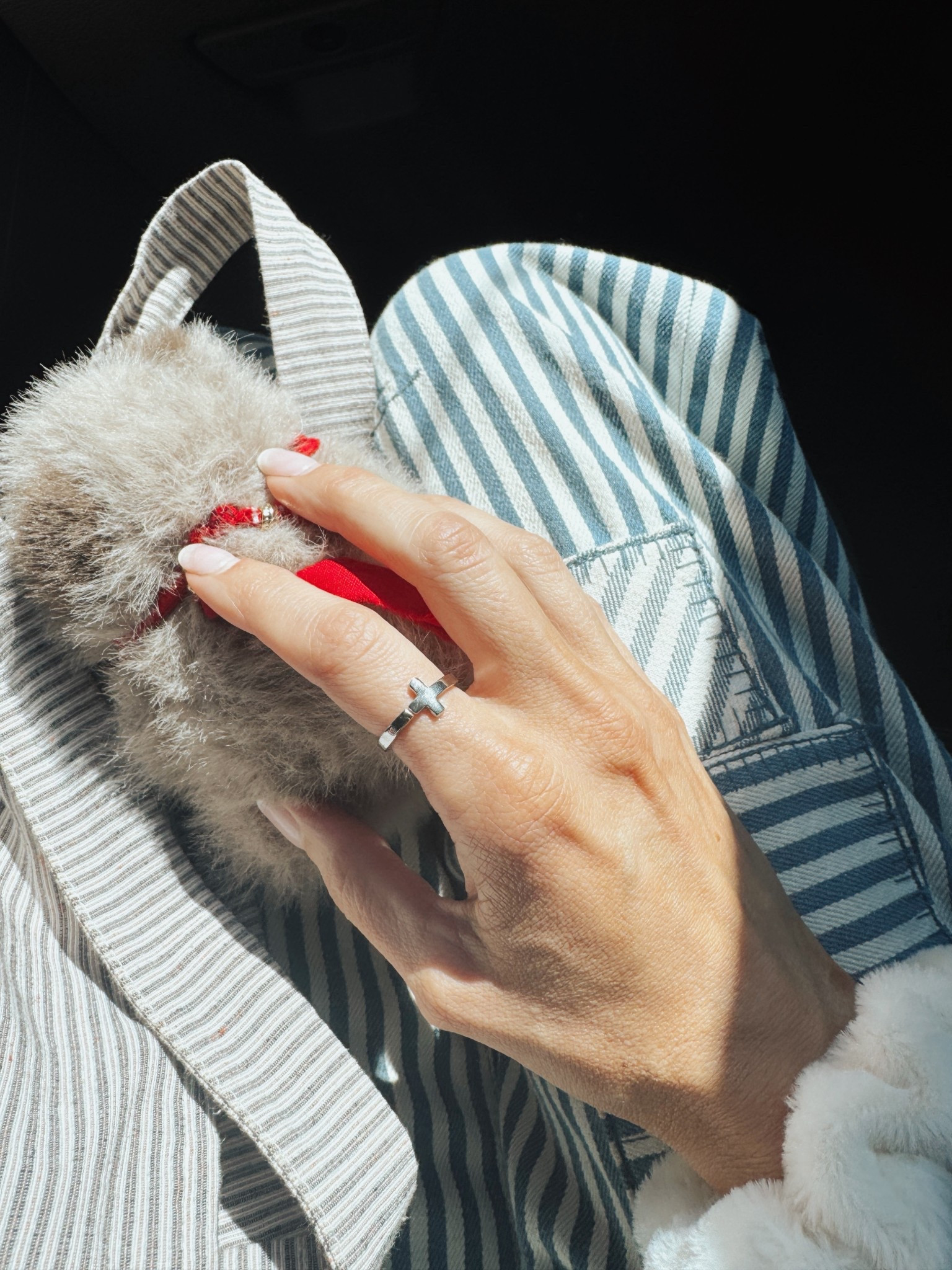 This adjustable cross ring is simple and waterproof- comes in gold and silver. 