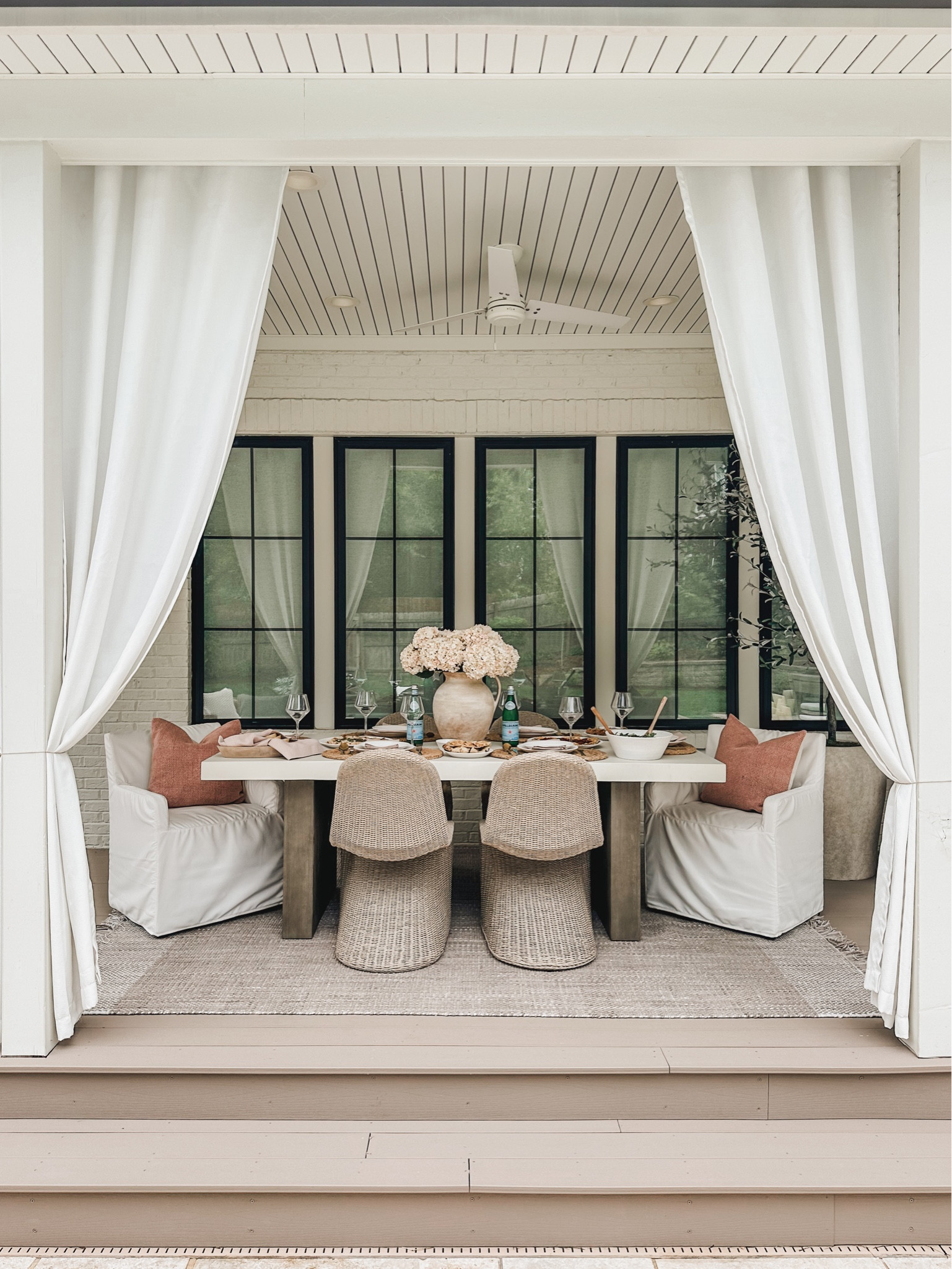 Light and bright Pottery Barn style outdoor space with oversized table, creamy white outdoor curtains, and weather resistant seating 

Summer refresh, outdoor refresh, Pottery Barn style, outdoor furniture, light and bright, patio style, outdoor dining table, wicker furniture, accent chair, neutral area rug, tablescape, faux floral, faux olive tree, outdoor curtain, outdoor planter, throw pillow, vase finds, jute rug, shop the look!

#LTKStyleTip #LTKHome #LTKSeasonal