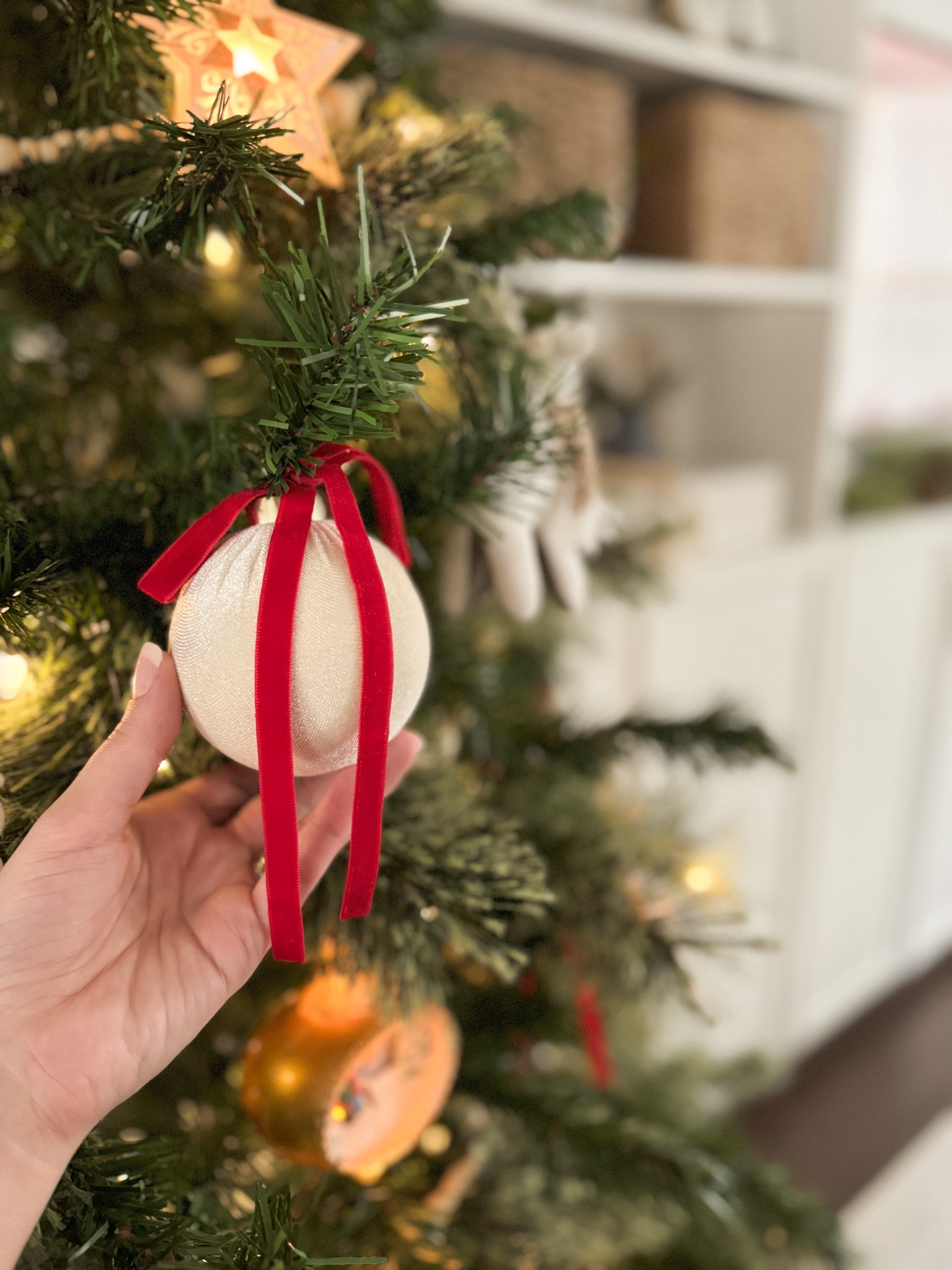 If you have kids, this bow ornament hanging hack will be life-changing!! Since Gabriel is a very active one year old, I was terrified of having ornament hooks on my tree this year. So, instead of using ornament hooks, I used these darling velvet bows with ties on them! I am obsessed with the way it looks, and the bows add the perfect pop of Christmas red. ❤️



#LTKHome #LTKHoliday #LTKSeasonal